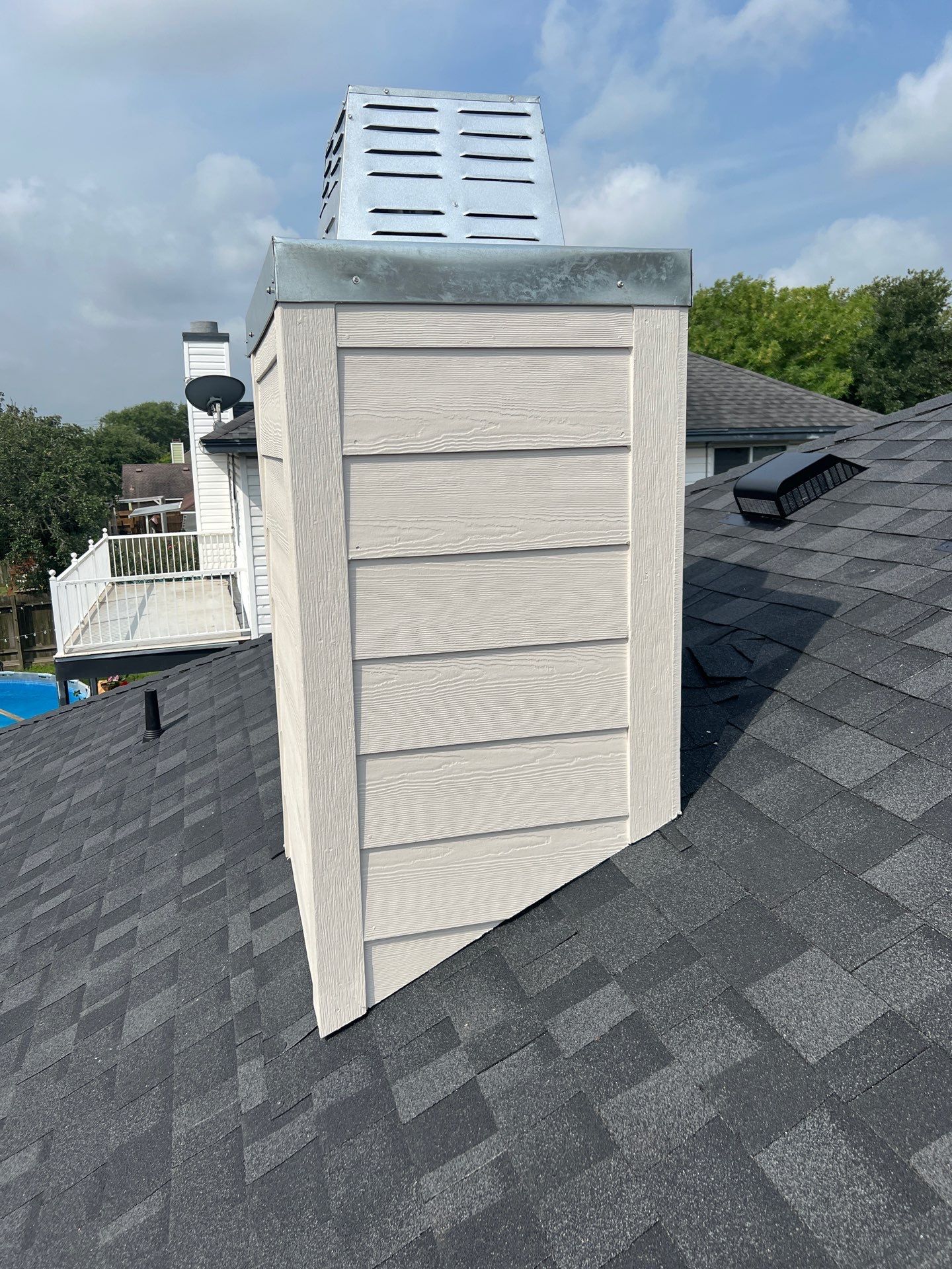 Nothing looks nicer than a little black roof by Bayfront Roofing and Construction