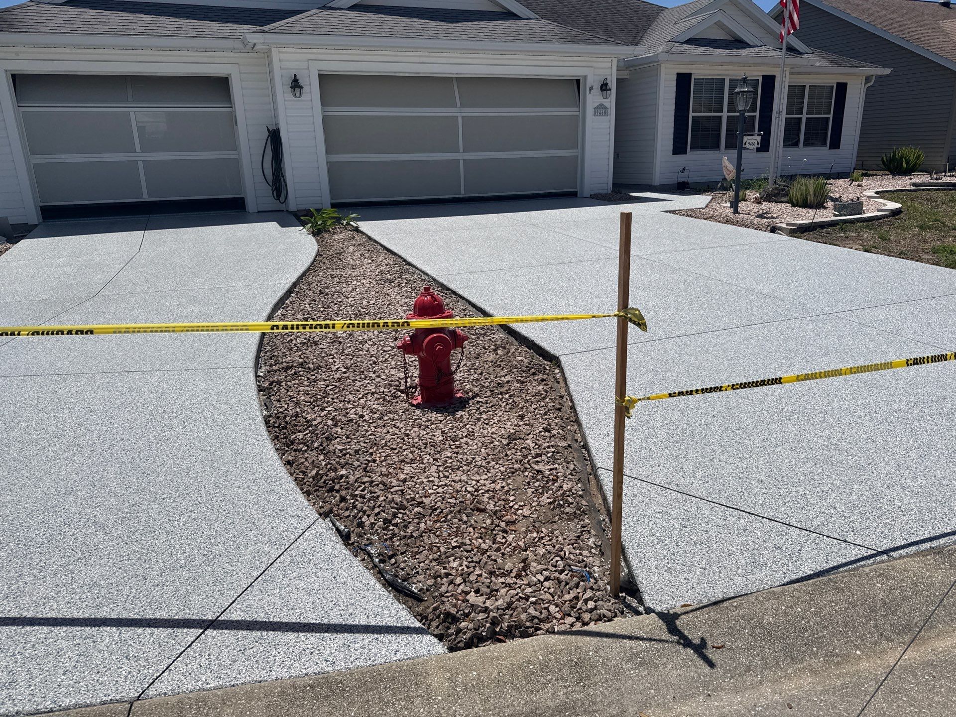 Garage, Drivewat, and Sidewalk in Landshark and Tidalwave by Innovative Concrete Coatings 