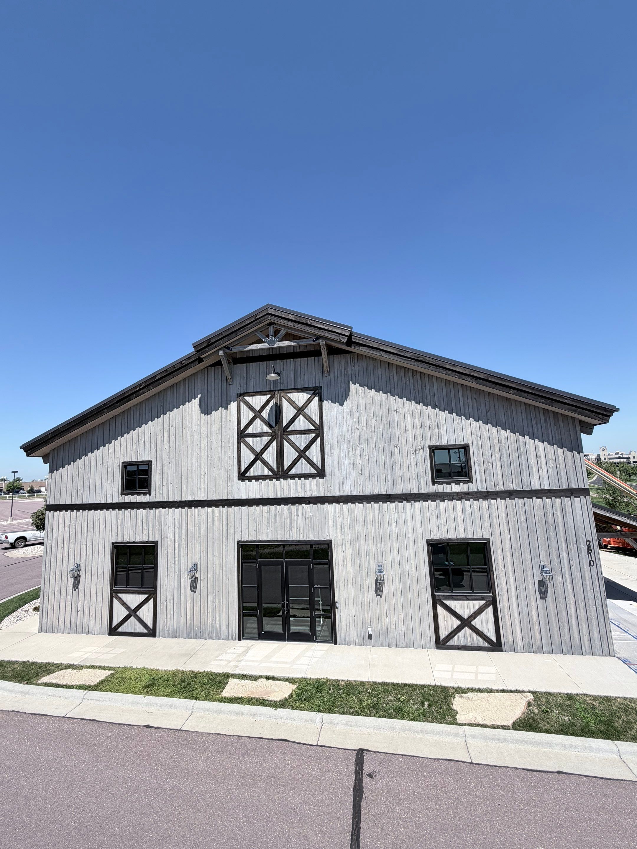 Commercial Exterior Wood Staining for Sanford Barn in Sioux Falls by Select Painting, Coatings & Garage Cabinets