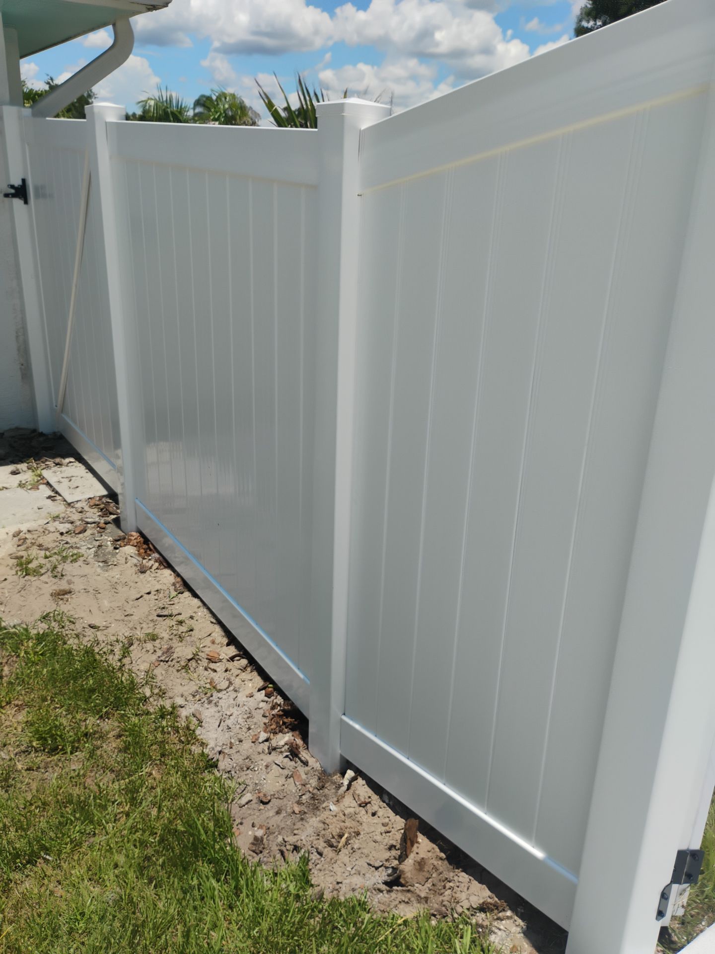 White Vinyl Privacy Fence Installation and Gate Repair in Port Charlotte by True Fence LLC