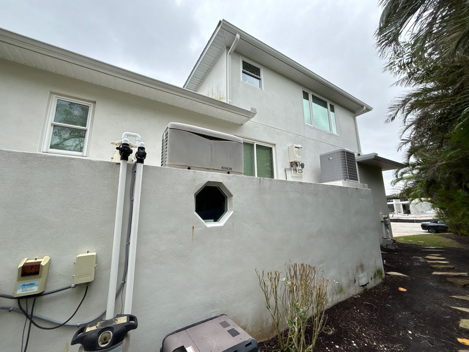 6-Inch White Seamless Gutters Installation in Siesta Key FL by Gutter Professors