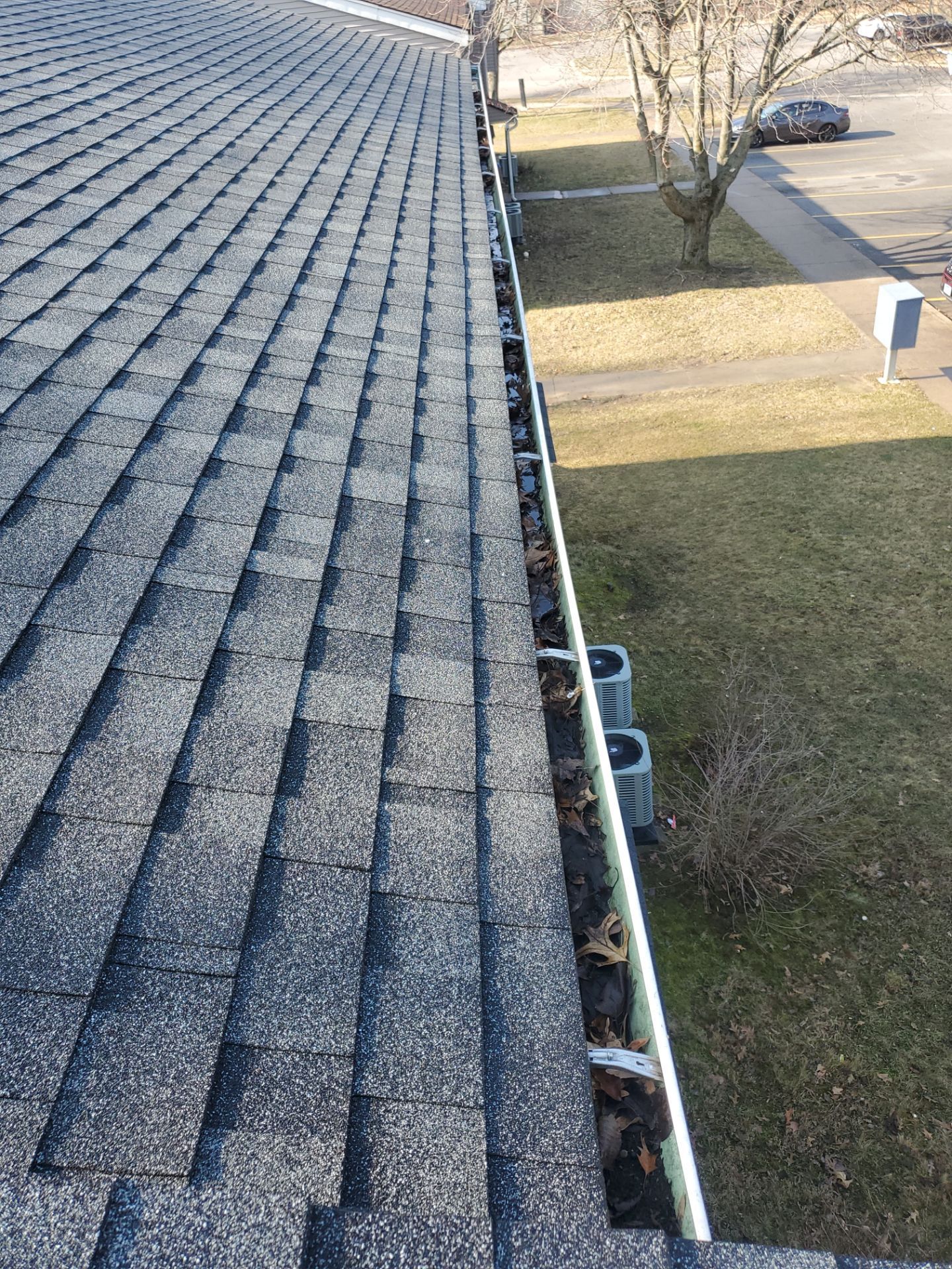 Commercial gutter cleaning Illinois before photo with filled gutters