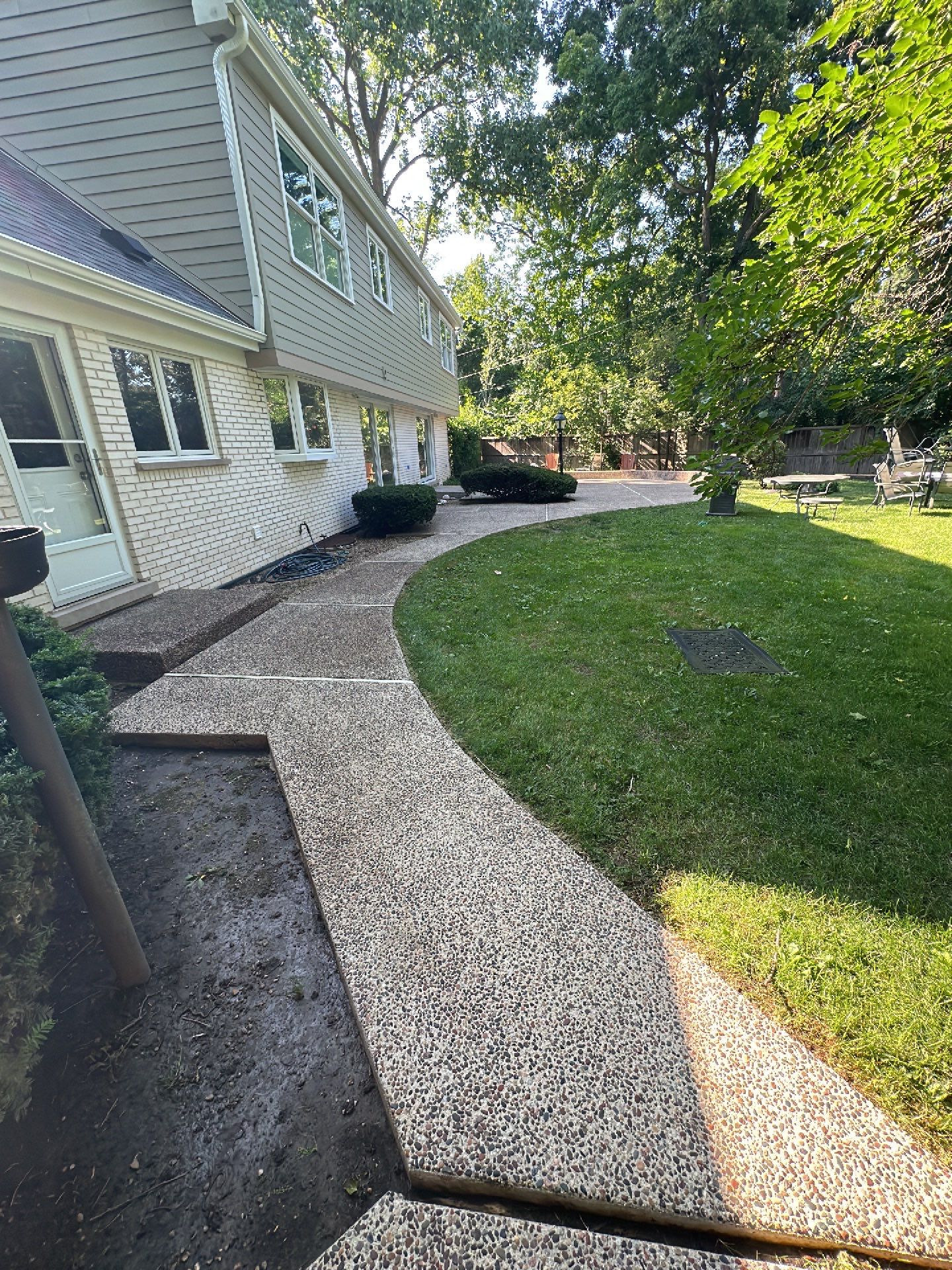 Aggregate concrete cleaning and sealing using Surebond SB-9000 by Northern Power Washing LLC.