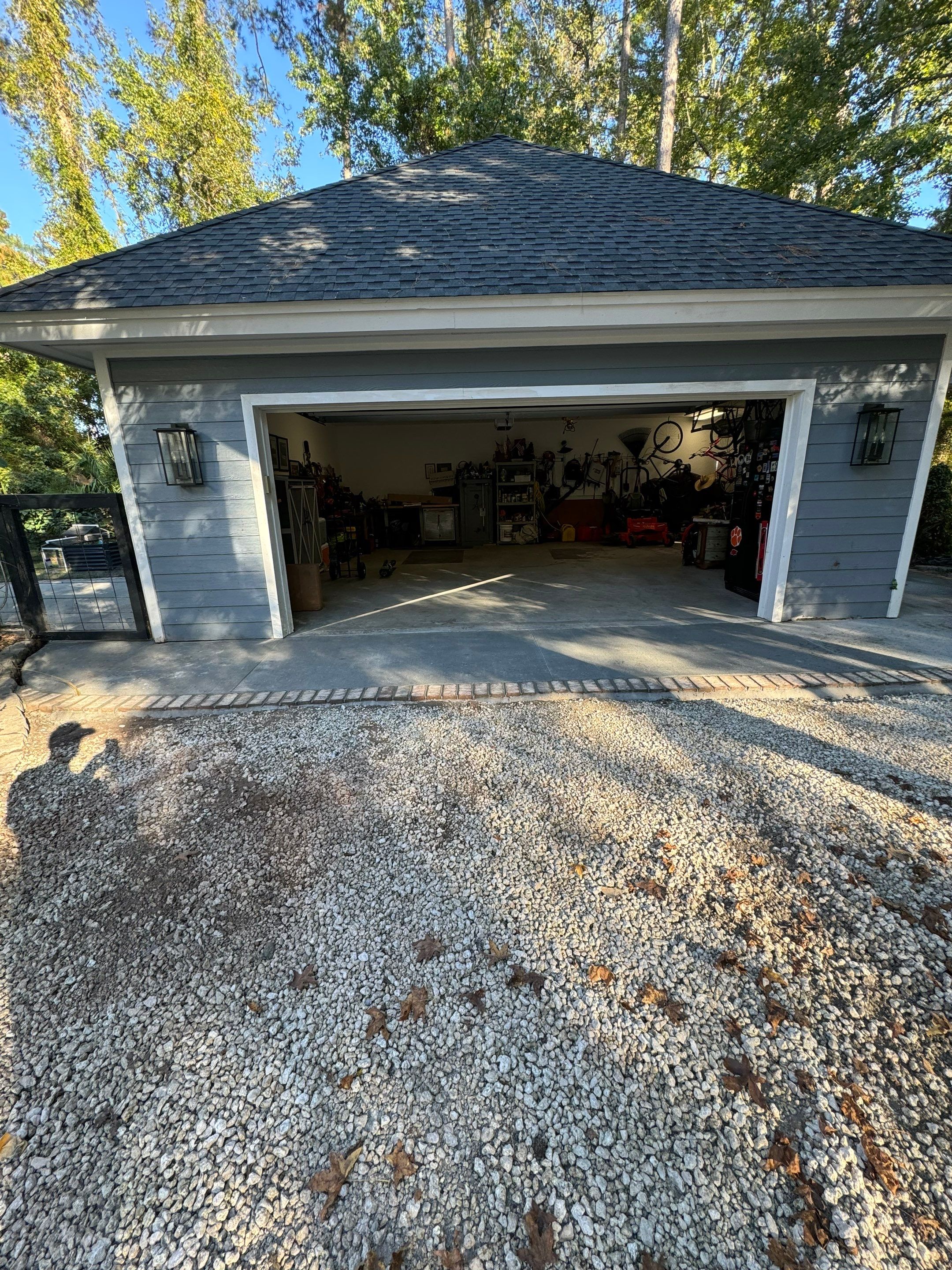 Concrete Driveway and Patio Installation With Decorative Brick Borders by Lowcountry Scapes, LLC