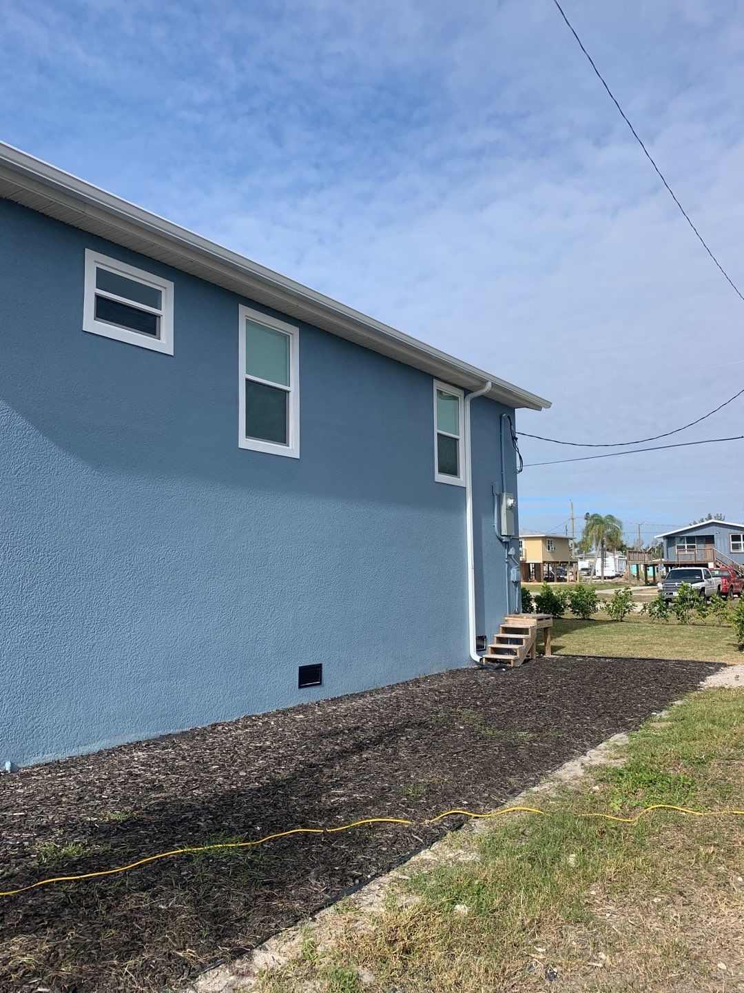 Downspout Installation for Two-Story Home in Fort Myers FL by Gutter Professor by Gutter Professors