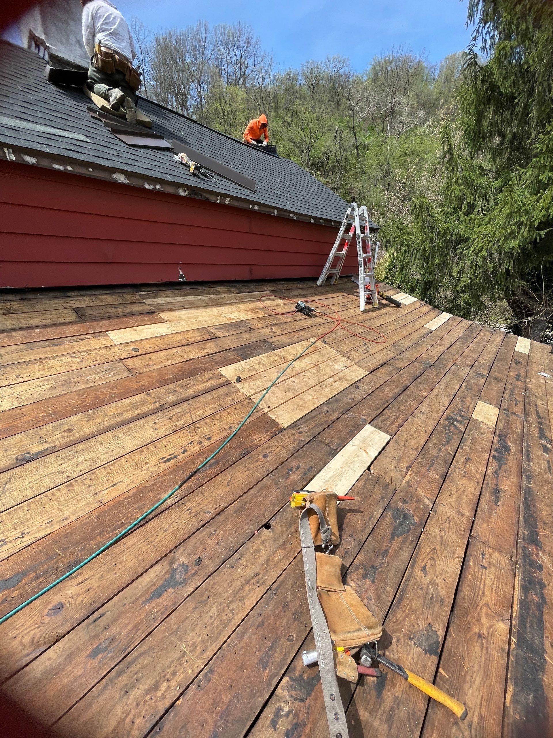 Roof sunspace deck  by Cousins Roofing Siding & Decks