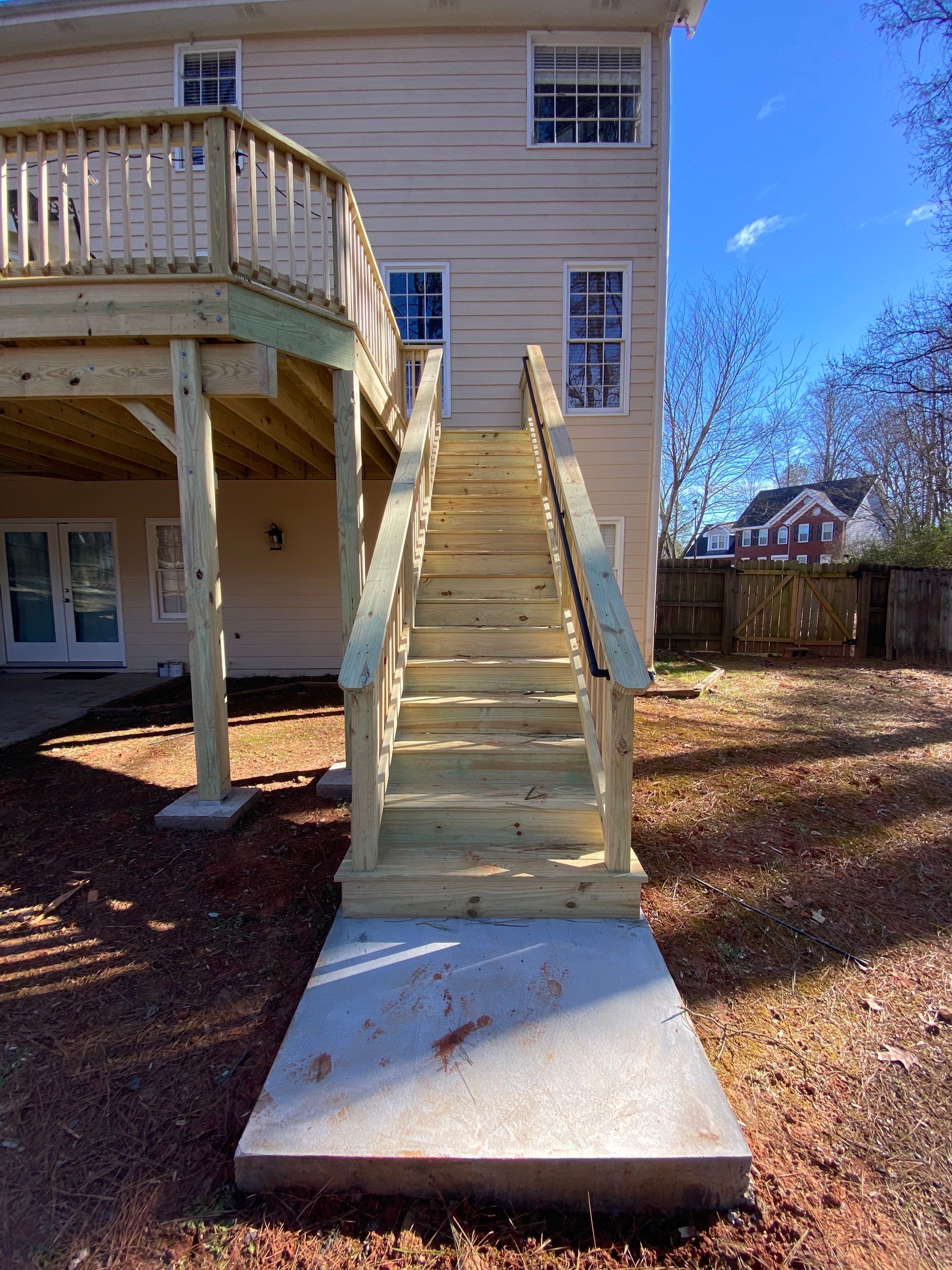 Elevated Pressure-Treated Wood Deck Replacement and Staircase in Duluth by Swift Home Renovations