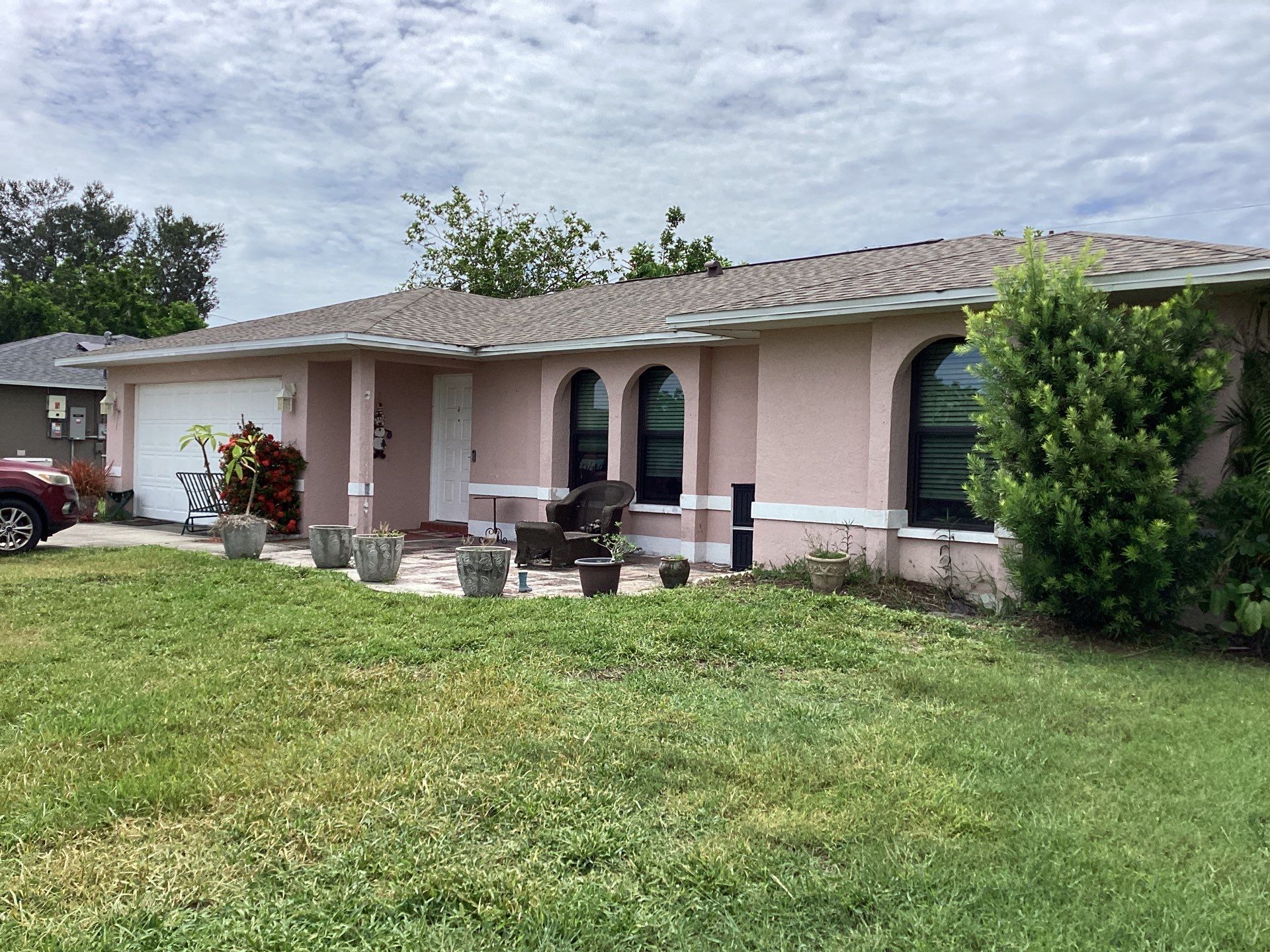 Replace gutter using White Down Spouts in Cape Coral FL by Gutter Professors