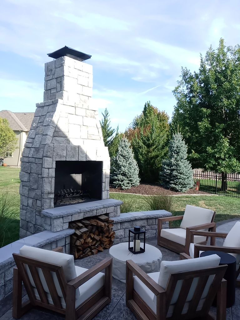 Back Yard Fireplace and Landscape by LAND ESCAPES LLC