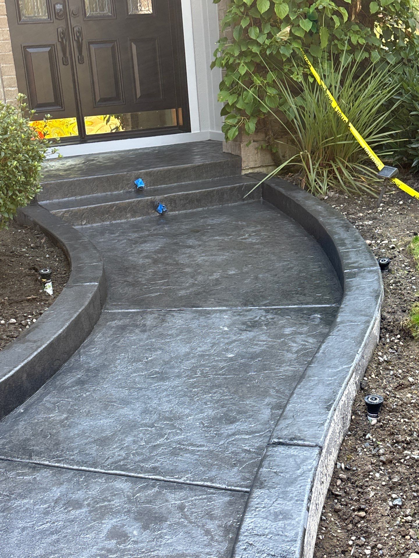 Multi-color Stamped & Sealed Concrete Driveway Renovation | Mukilteo by Jireh Asphalt & Concrete Inc