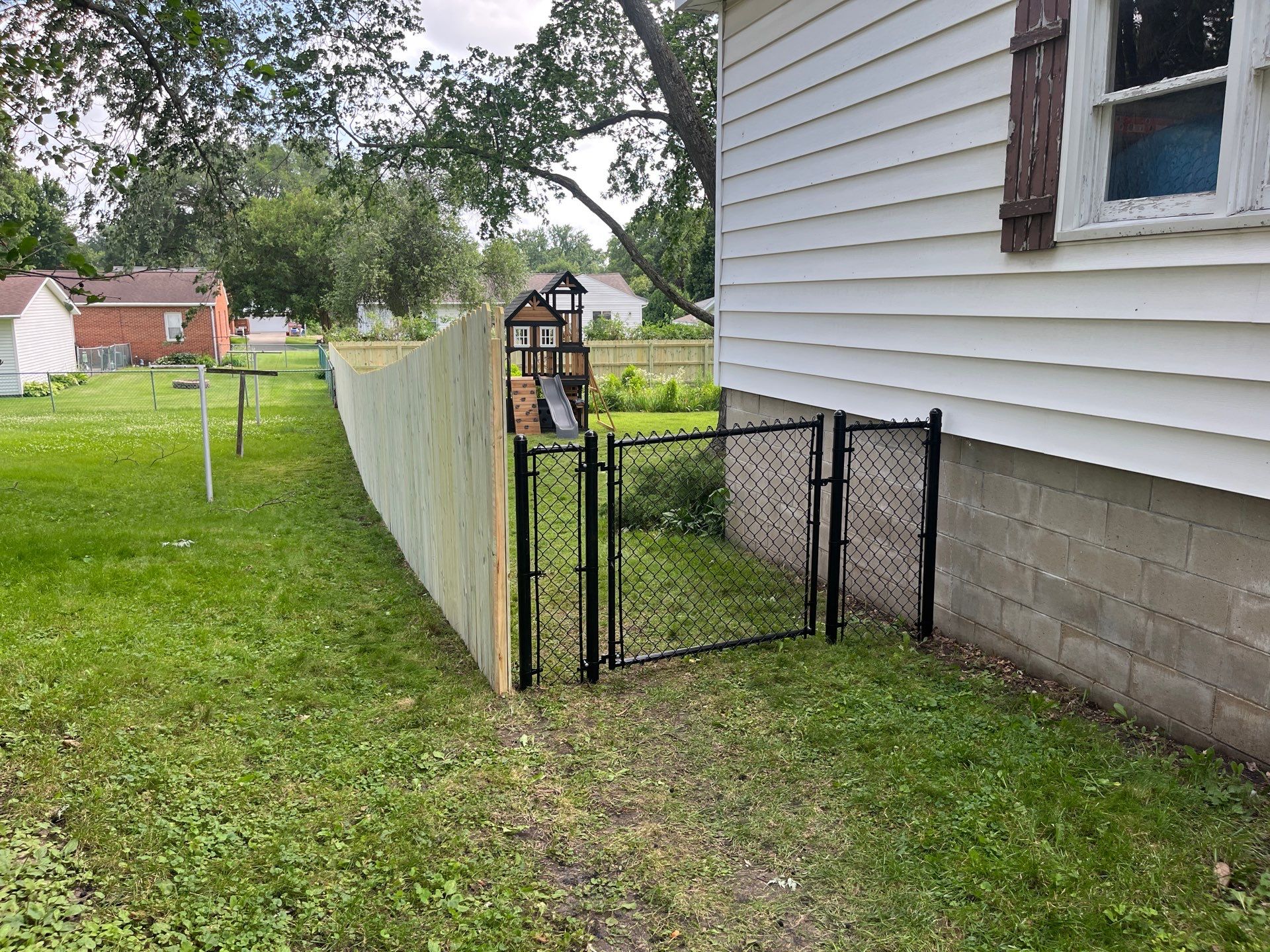 Custom Treated Pine Privacy Fence and Chain Link Installation in Cedar Falls by Perfect Picket Fence and Stain