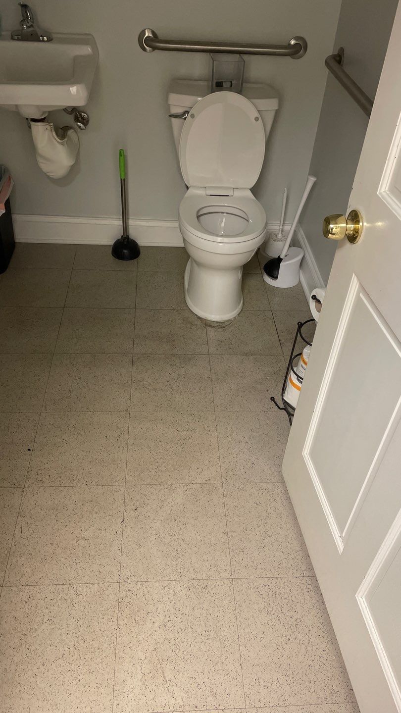 Office Remodel from Worn Out Carpet to Sleek Glued Down LVP by Footprints Floors of Coastal Carolina