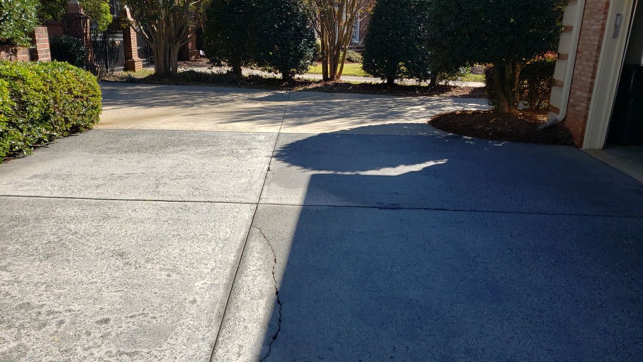 Driveway Clean using cleaner by Power Wash Masters LLC