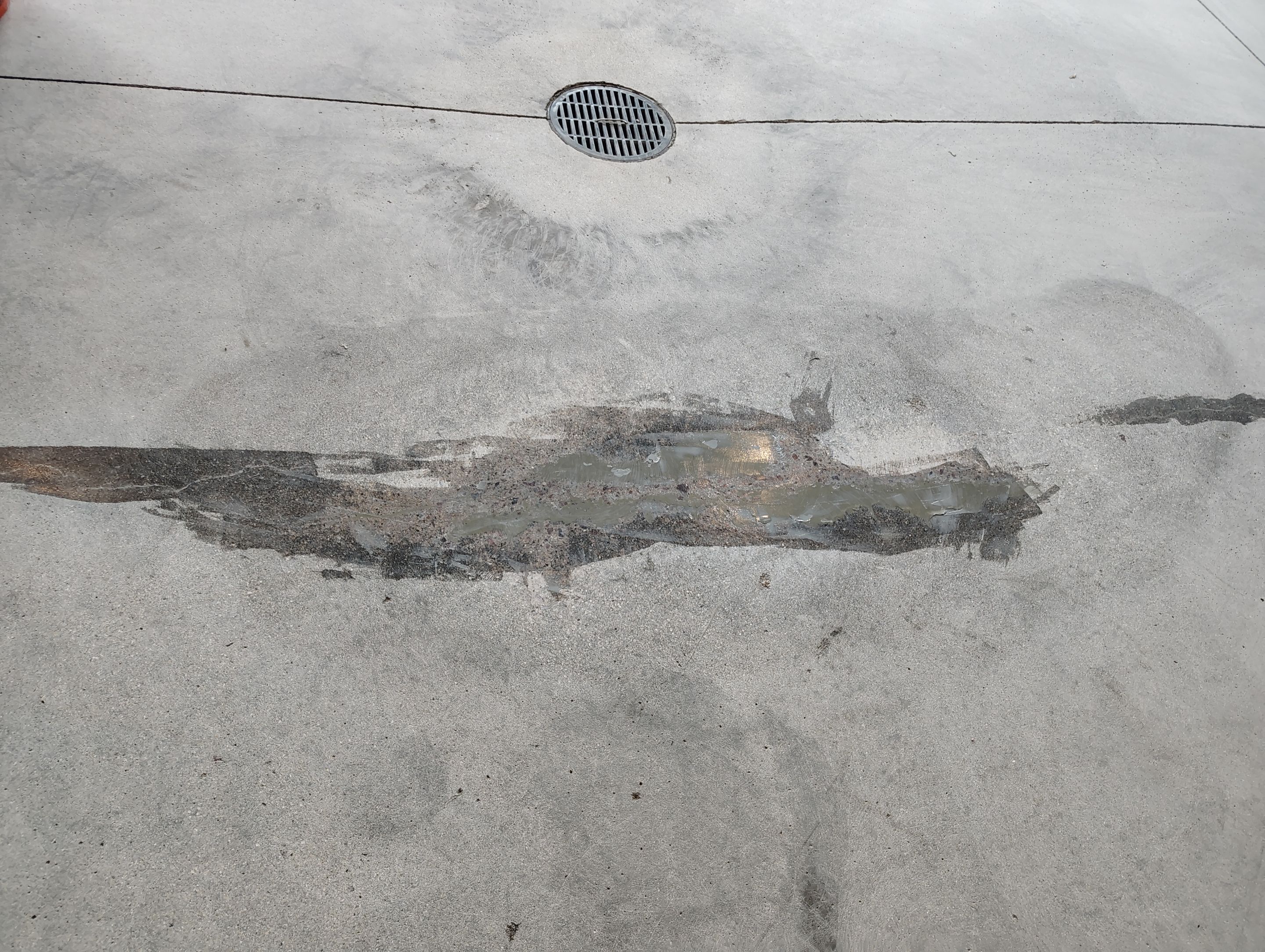 Multi-Car Garage Concrete Coating and Crack Repair in Dell Rapids by Select Painting, Coatings & Garage Cabinets