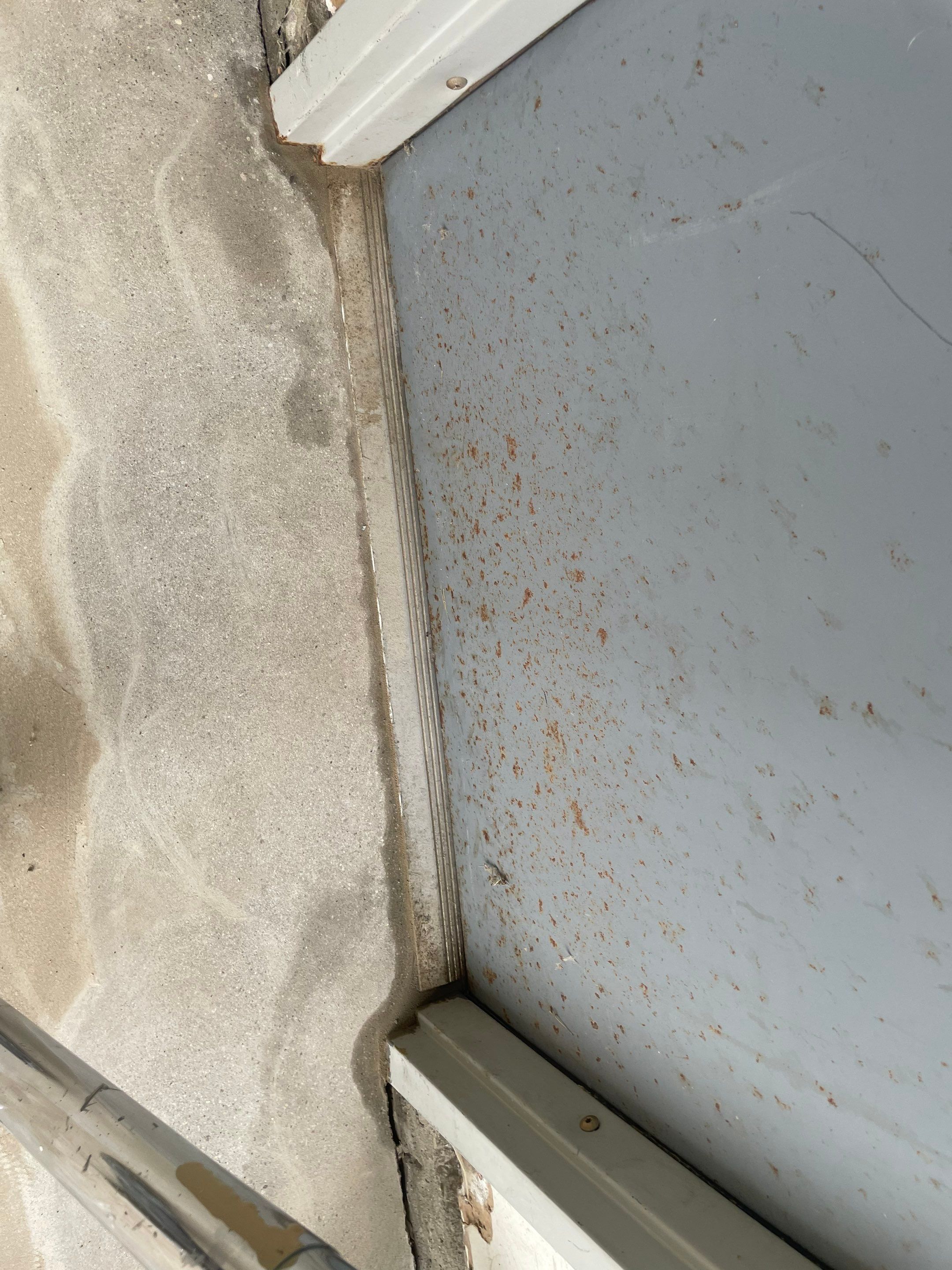 Coyote Flake Concrete Coating for Sioux Falls Garage by Select Painting, Coatings & Garage Cabinets