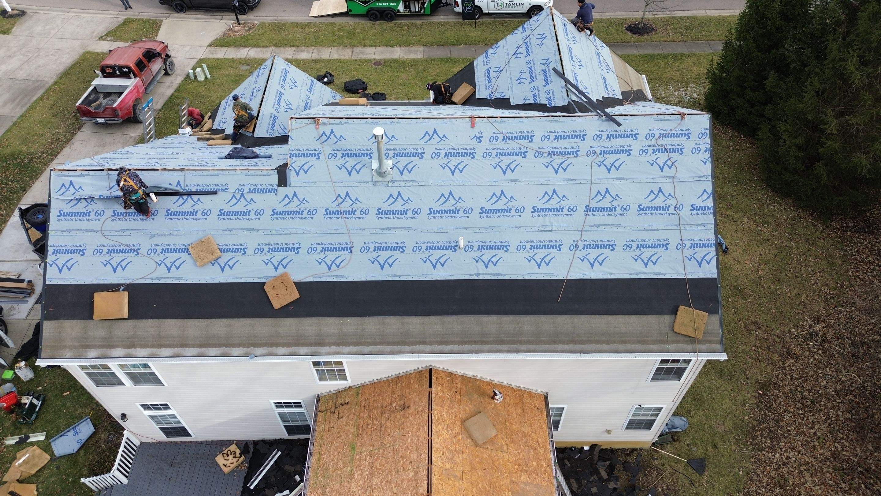 Walden Ponds - Pristine Black and Hydro Flo Gutter Guards by Tamlin Roofing