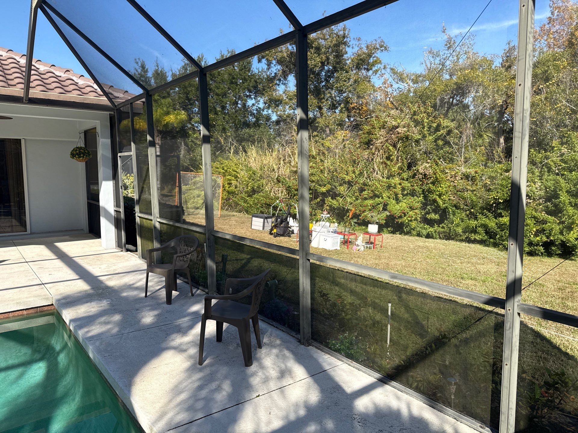 Painted Pool Deck, Lanai & Pool Cage Cleaning in River Club South – Bradenton, FL by Sunshine AquaWash
