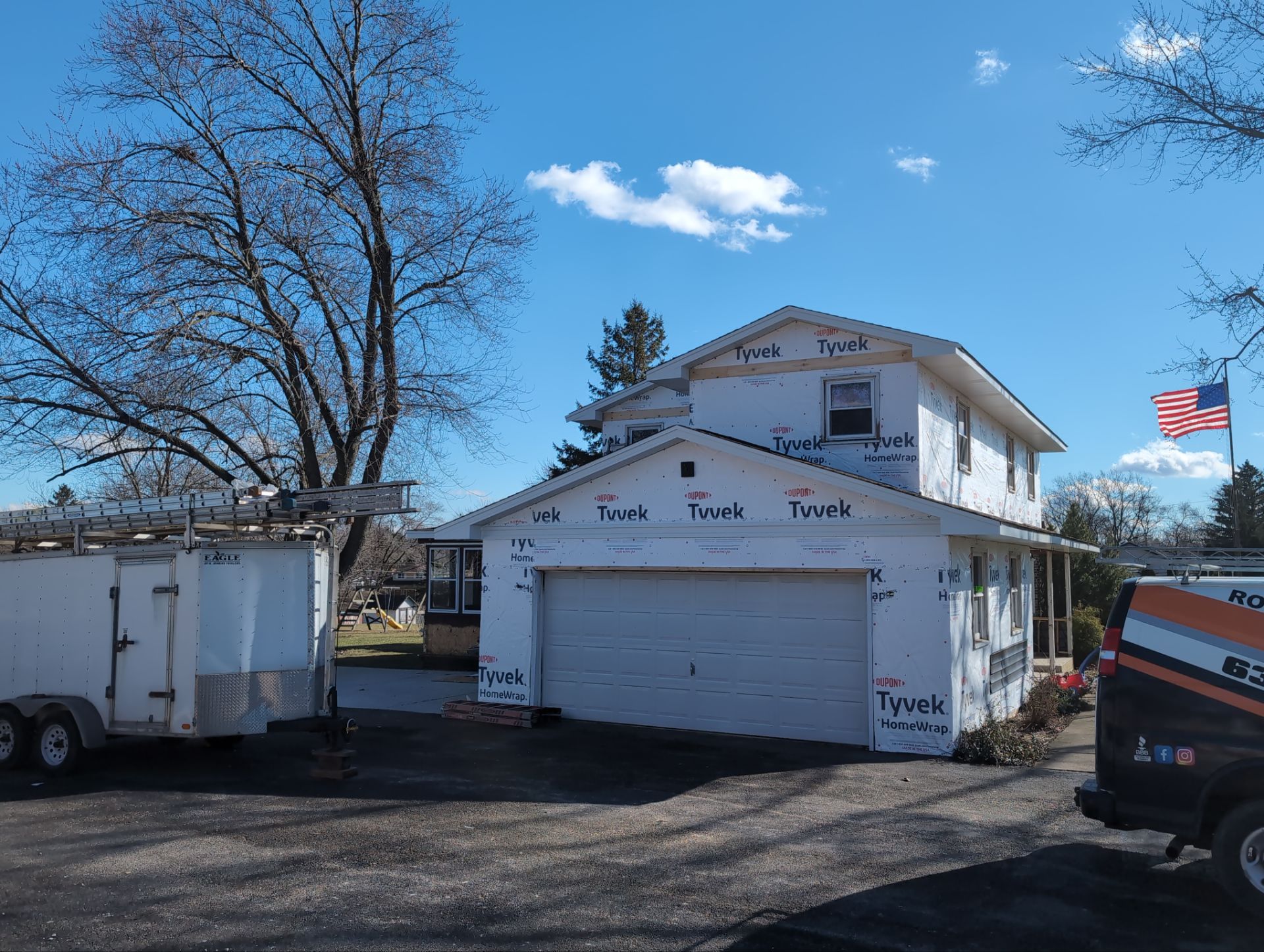 Vinyl siding replacement using CertainTeed Monogram double 5" vinyl siding  by AJ Exteriors & Roofing Inc.