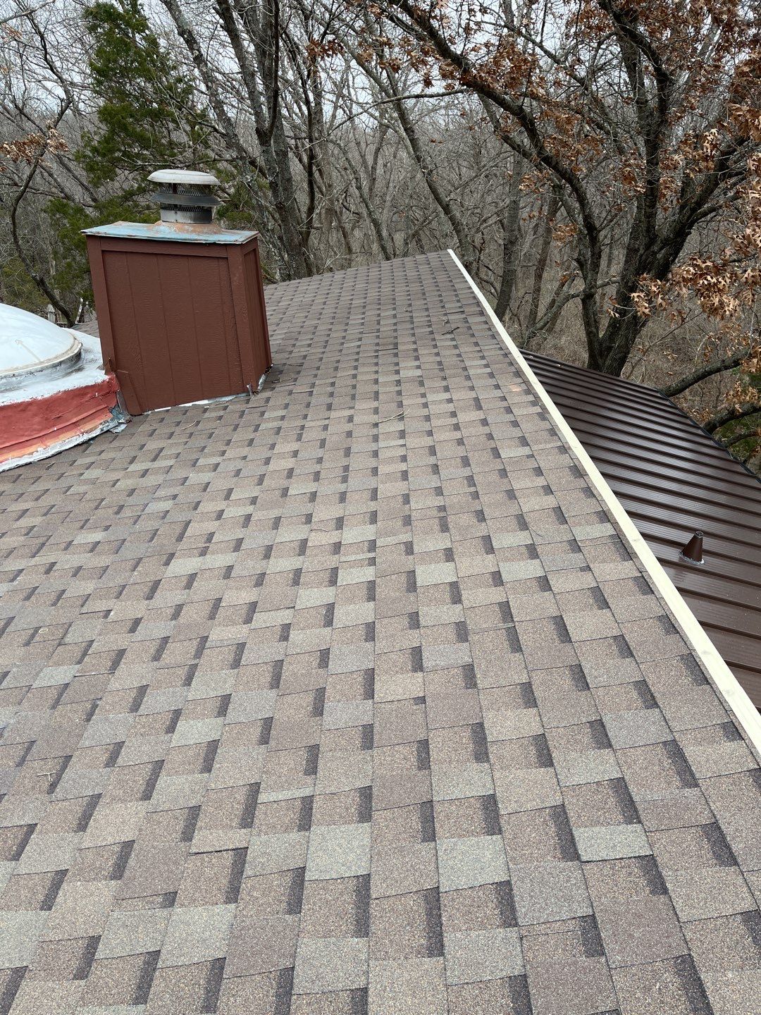 Residential Roofing Installation using Standing Seam Metal Roofing and Composition Shingles by Rainy Day Restoration