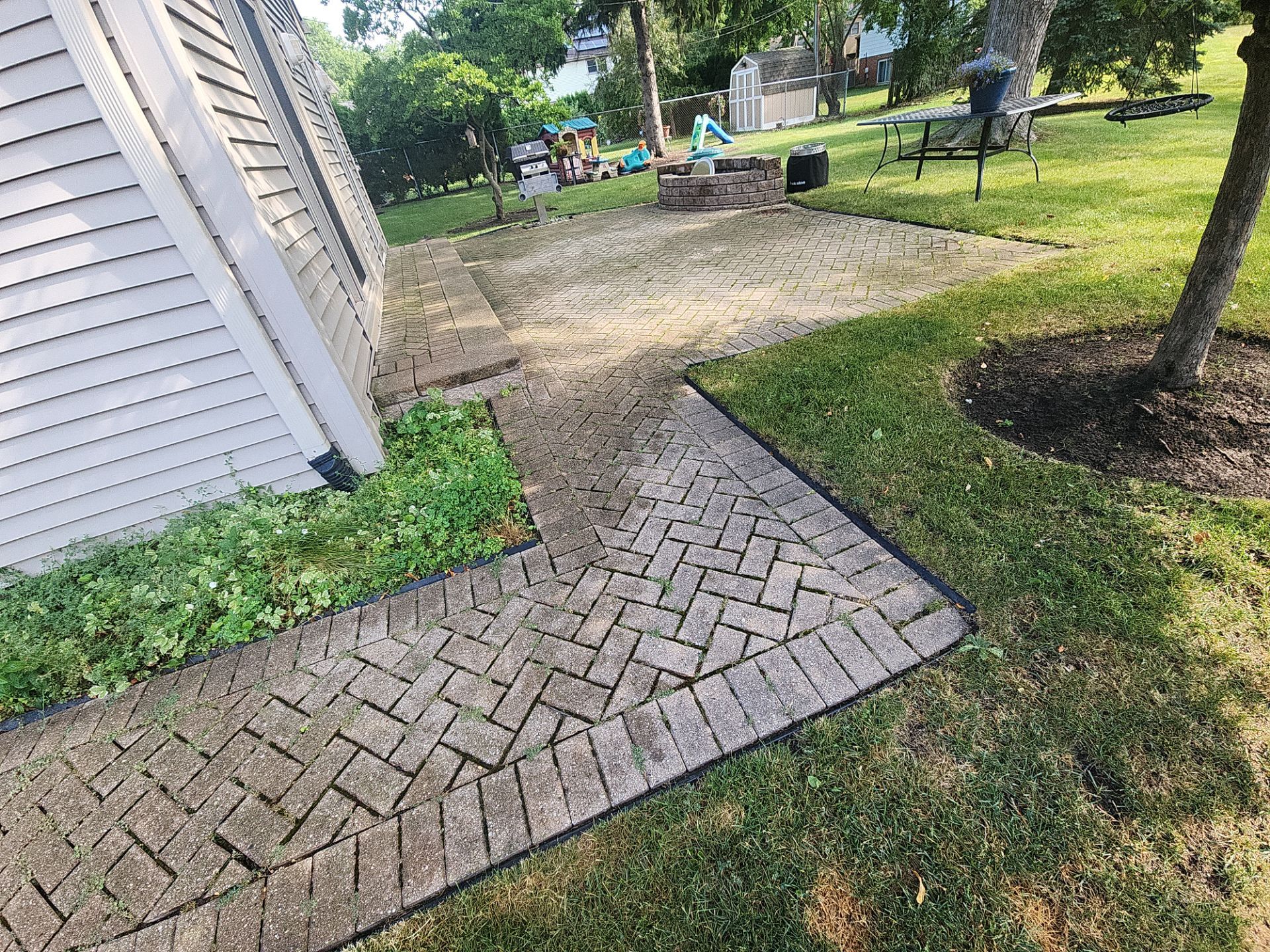 Arlington Heights Brick paver repair, cleaning and sealing by Northern Power Washing LLC.