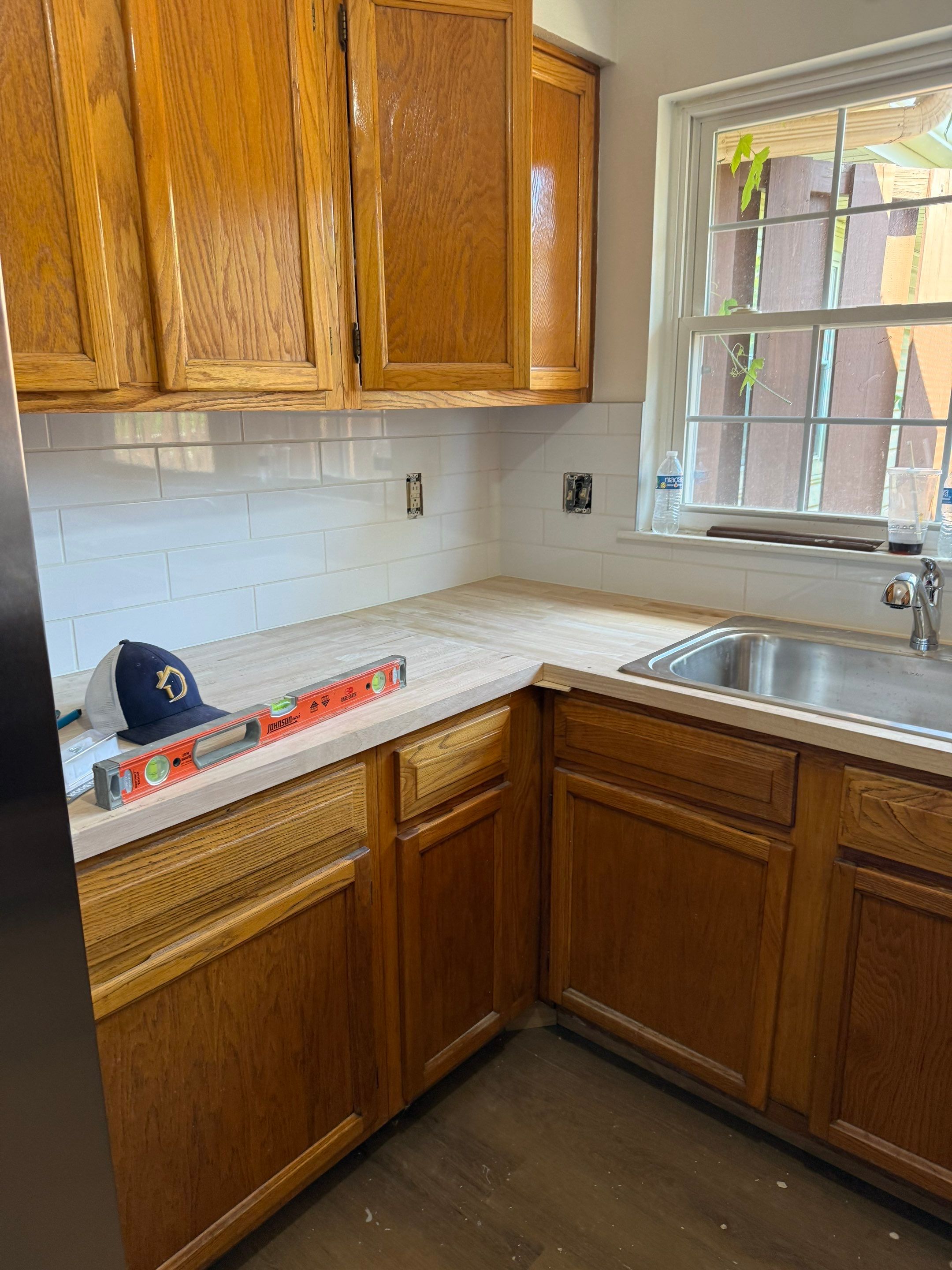 Complete Home Remodel Featuring Custom Kitchen and Wood-Look Plank Flooring by MAJO