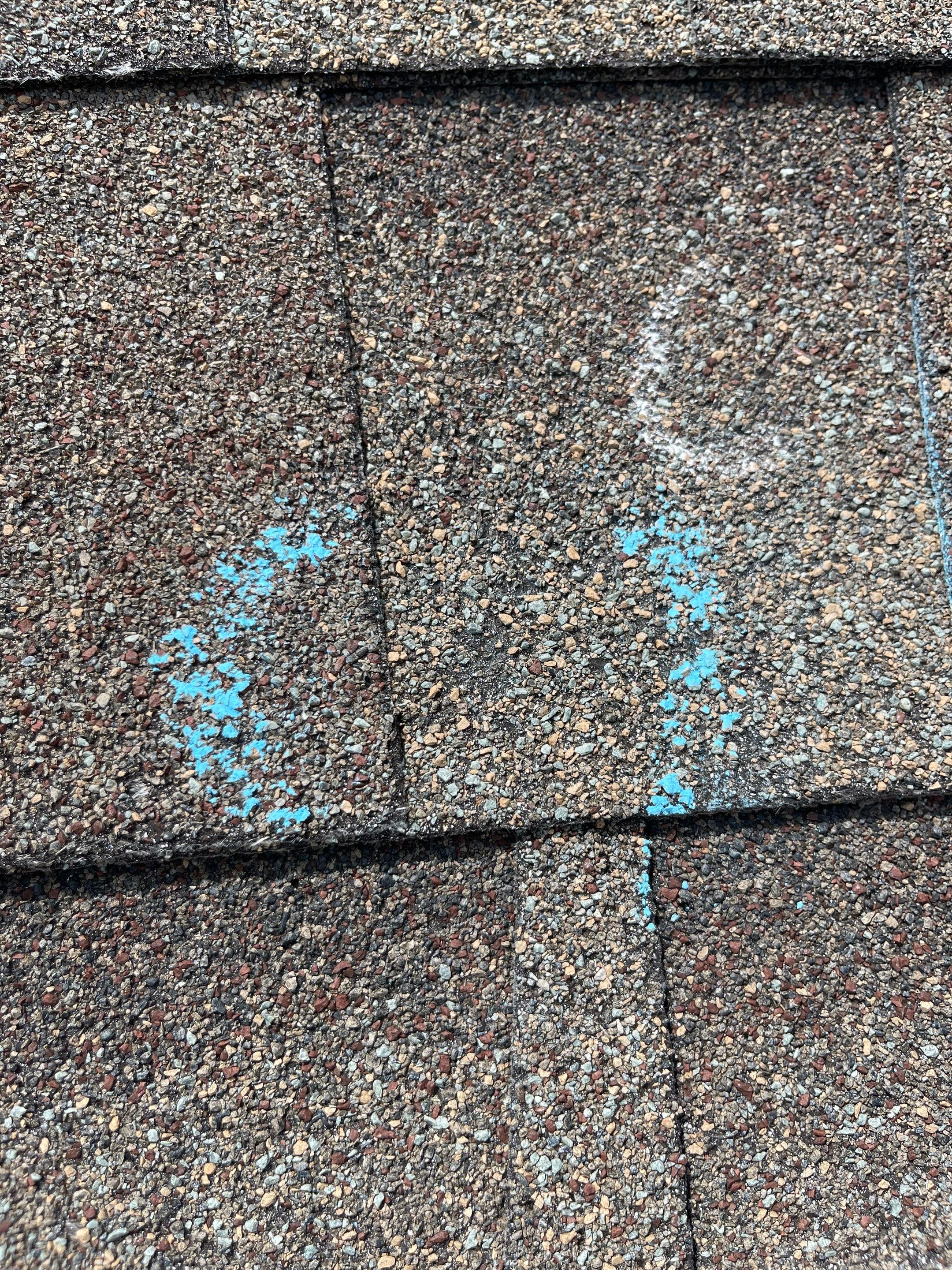 Hail Damage on a Roofing System by Icon Roofing And Construction 