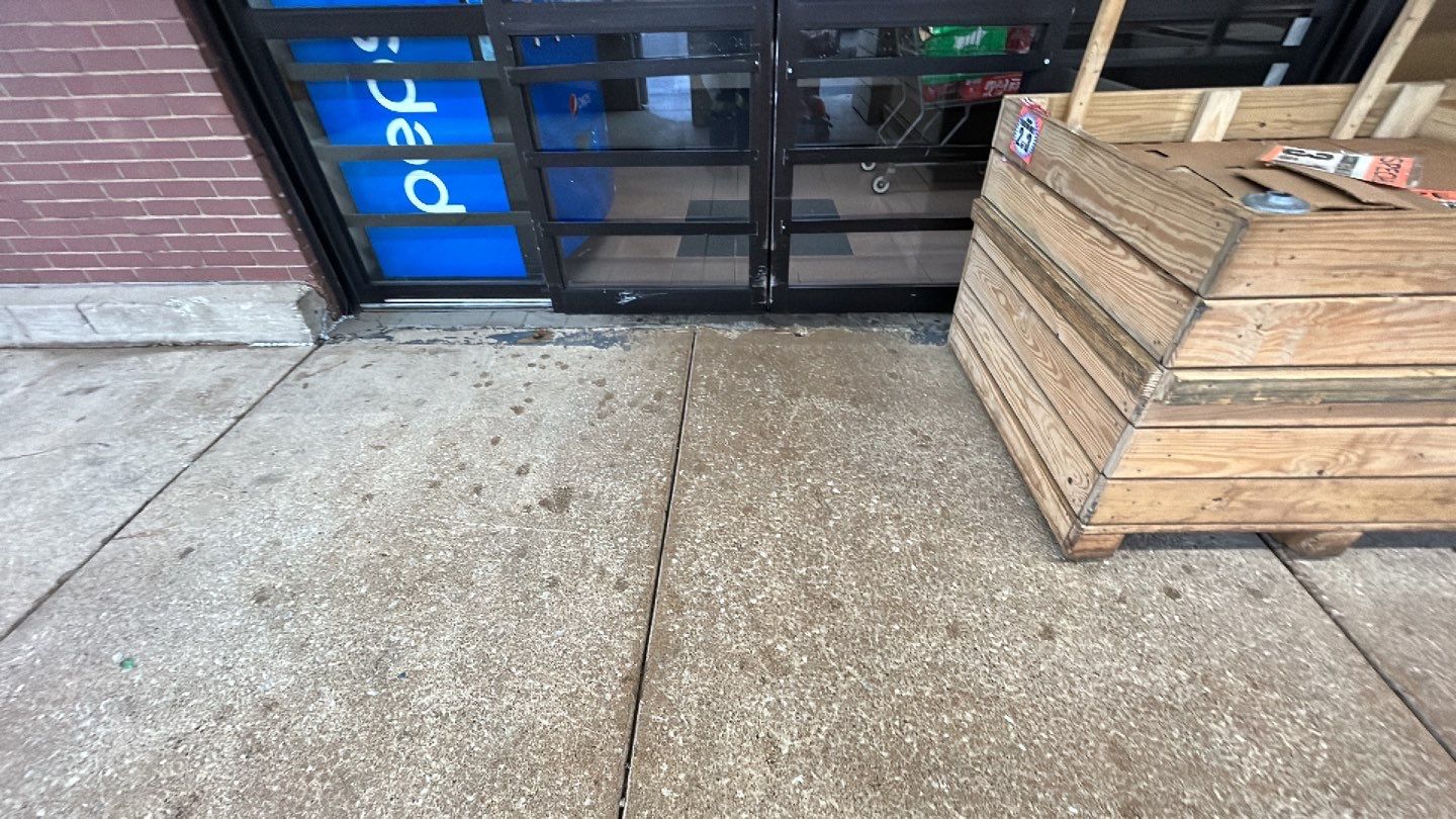 Concrete sidewalk cleaning and degreasing by Northern Power Washing LLC.