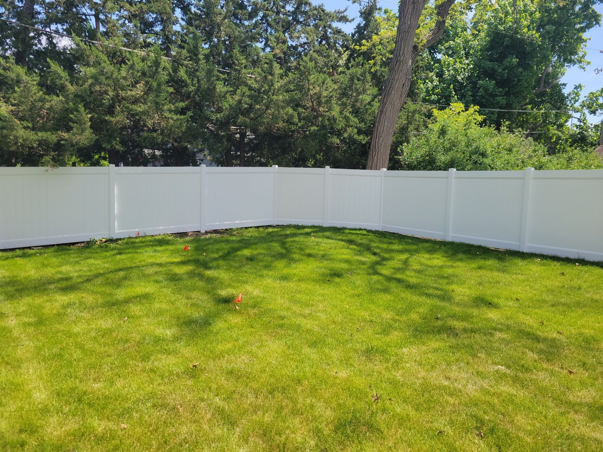 Residential White Vinyl Privacy Fence Installation in Waterloo by Perfect Picket Fence and Stain
