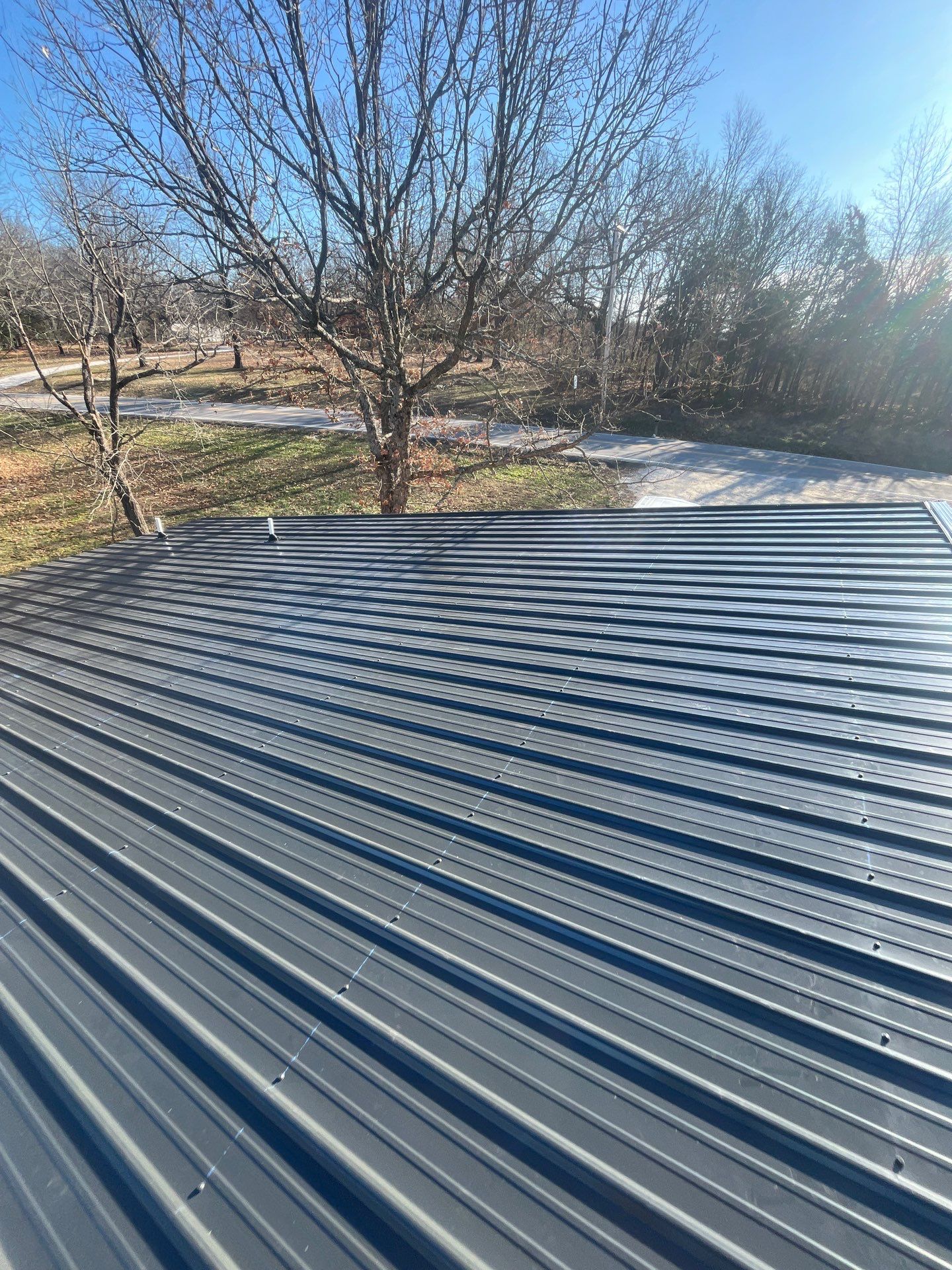 Residential Roofing Install - 29 Gauge G-Rib Metal - Color Black by Titan Commercial & Residential Roofing