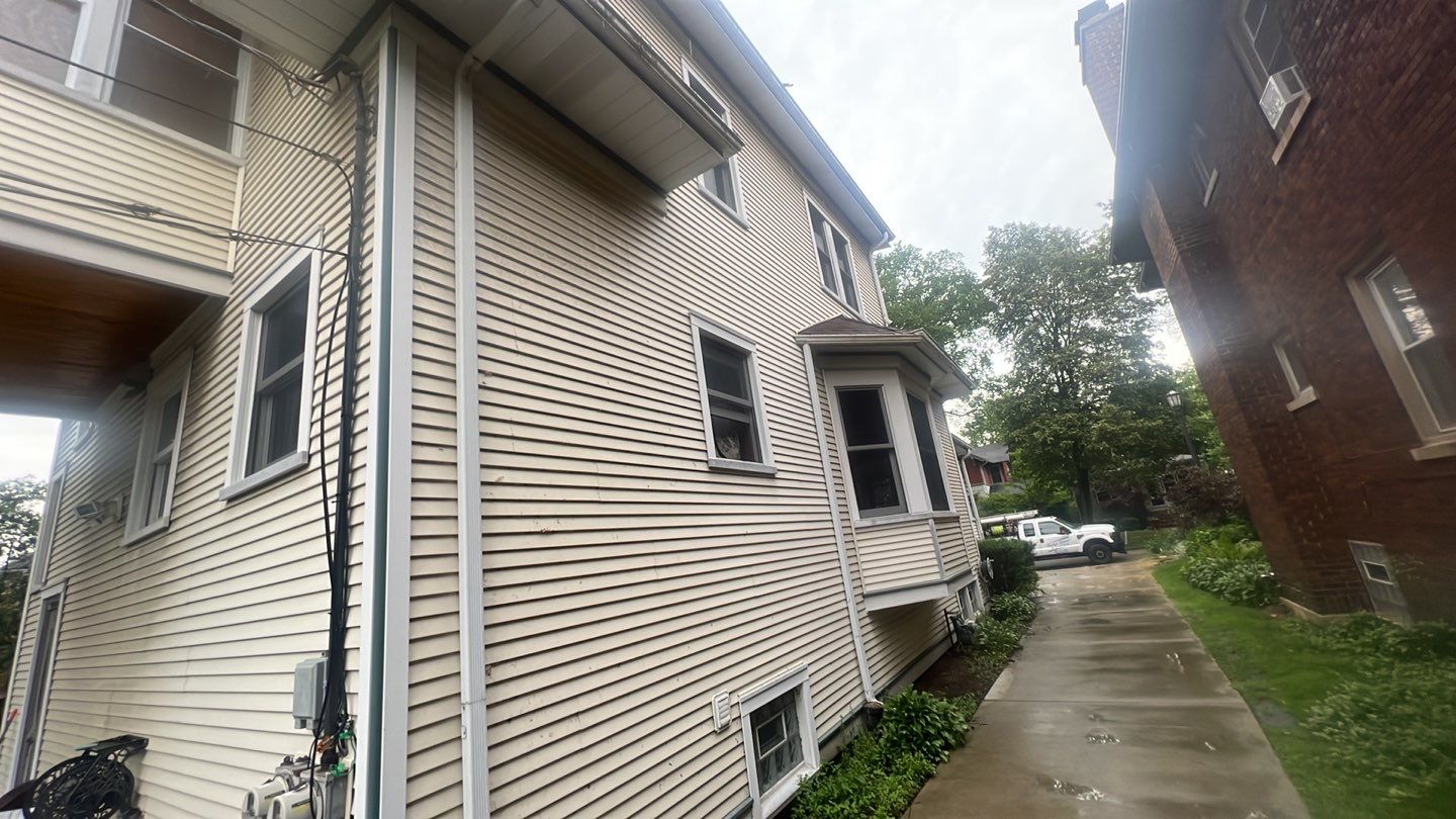 Housewashing  using Algaecide, soft wash soap by Northern Power Washing LLC.