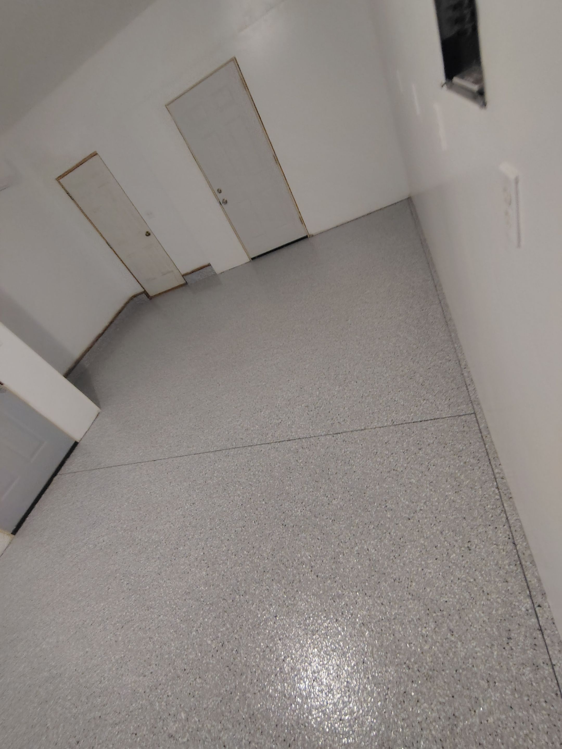 Decorative Chip Concrete Coating Installation in Luverne by Select Painting, Coatings & Garage Cabinets
