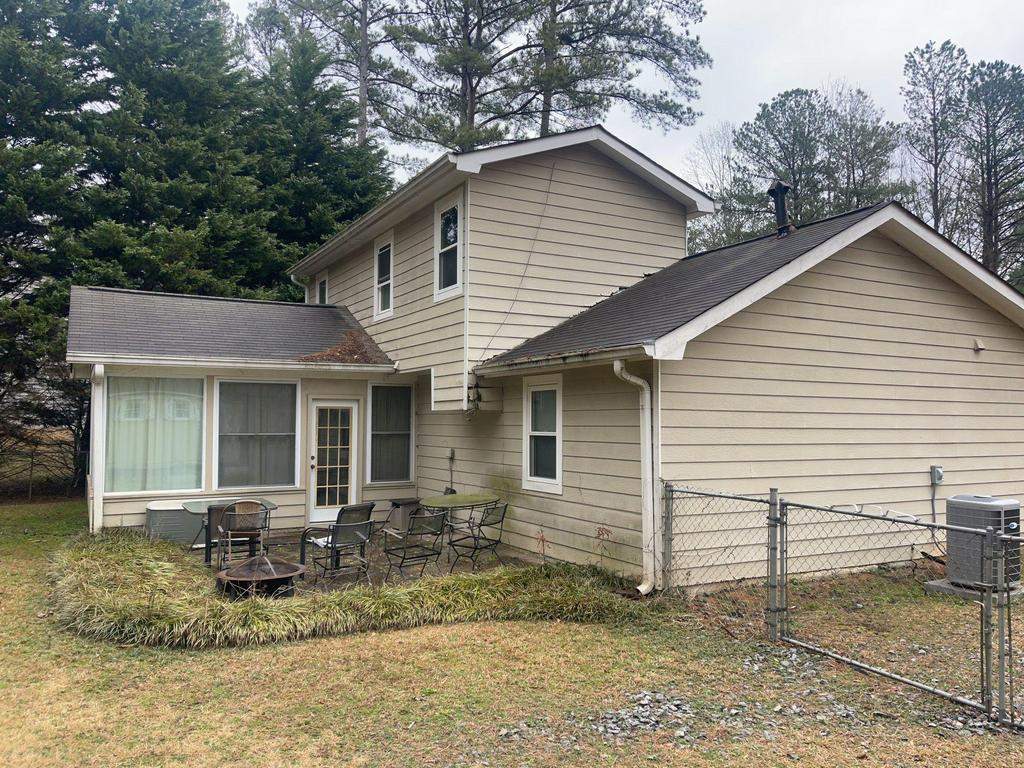 Marietta, GA Siding, Rotten Wood, Front Door, and Gutter Replacement with Exterior Painting by Nelson Exteriors