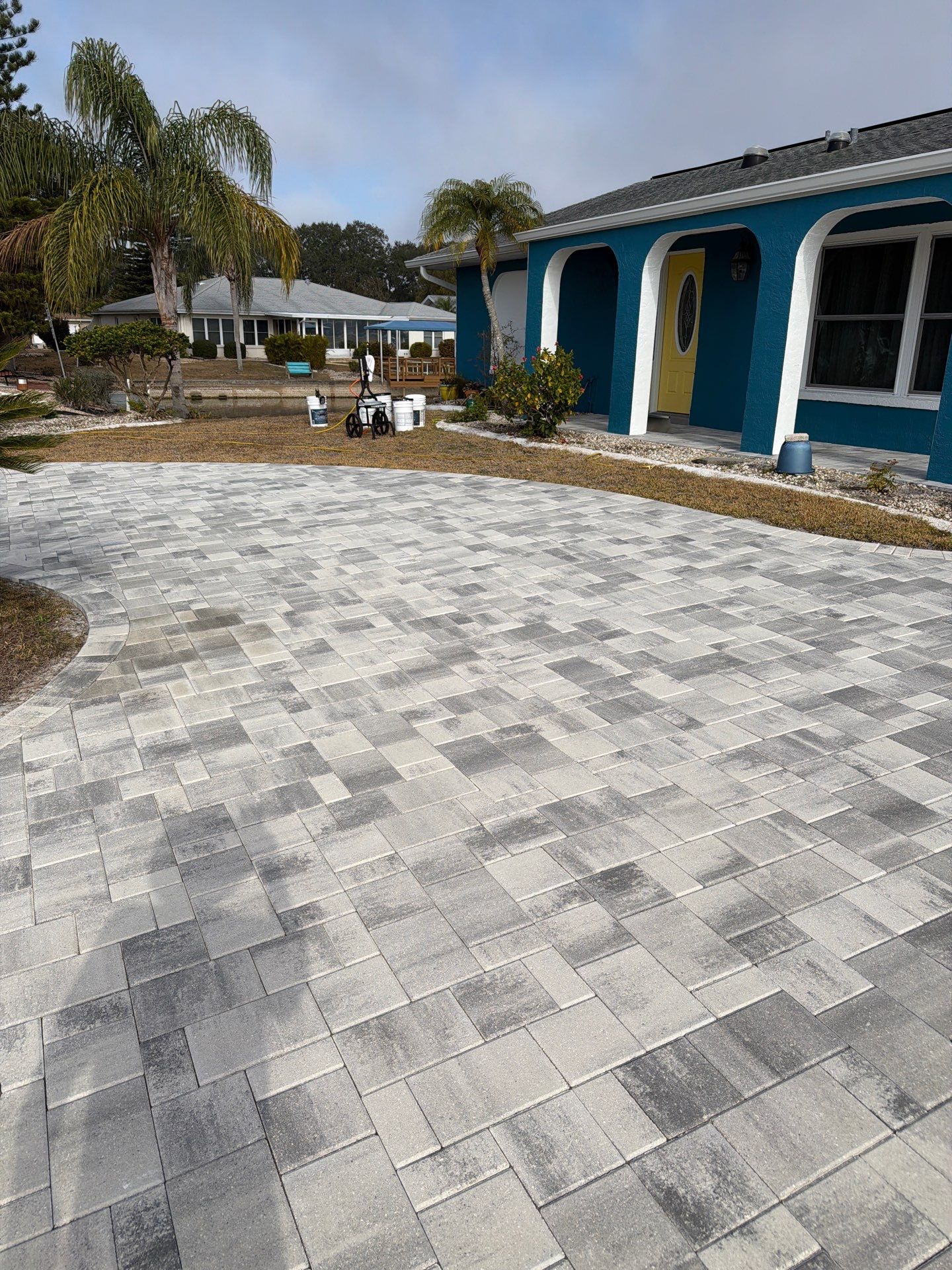 Modern Gray Paver Driveway and Entryway Walkway in Sun City Center by Supreme Paver Experts