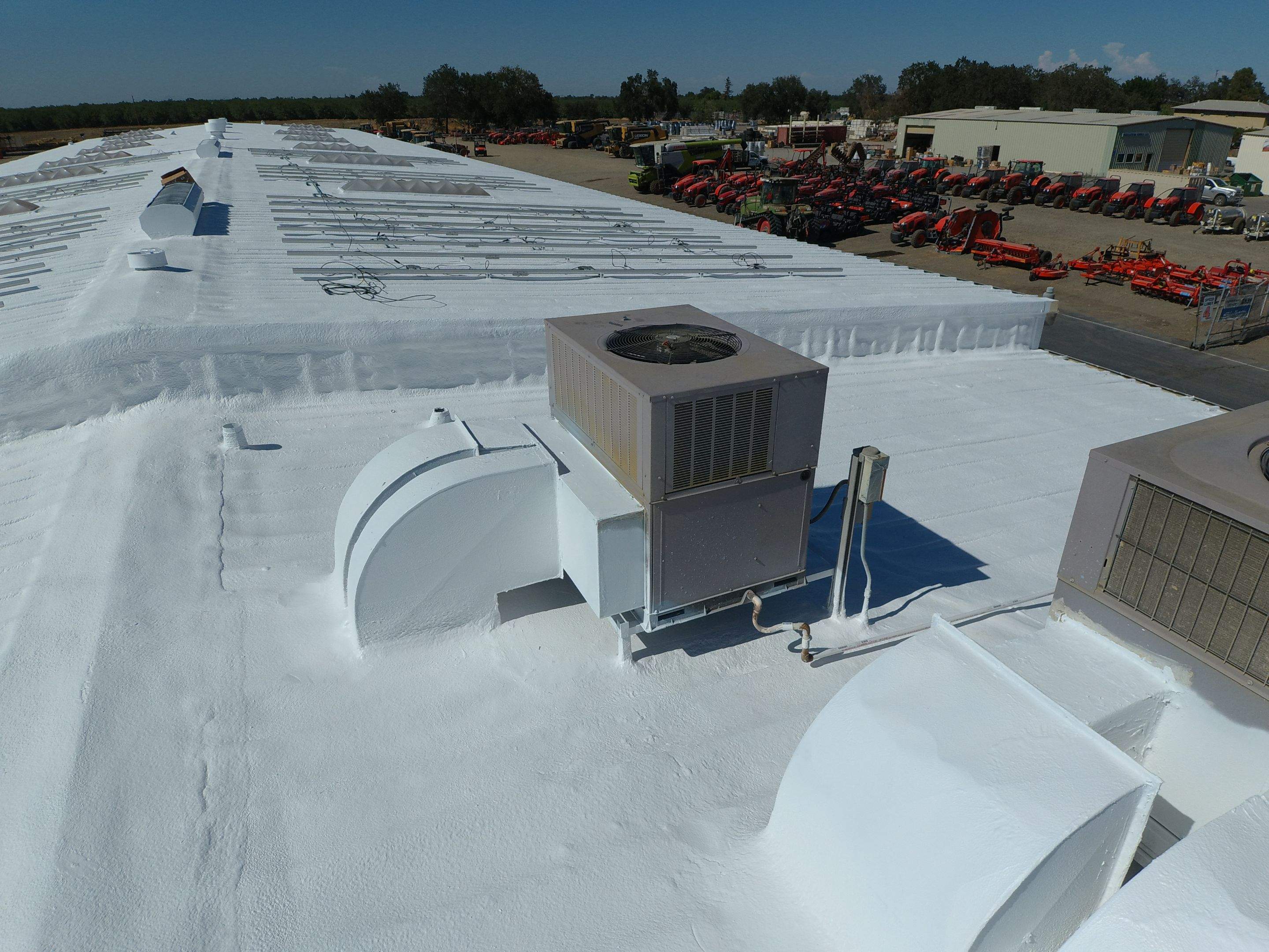 Spray foam and coatings using Conklin Benchmark/PUMA XL coatings and spray foam by Straight Edge Roofing Inc