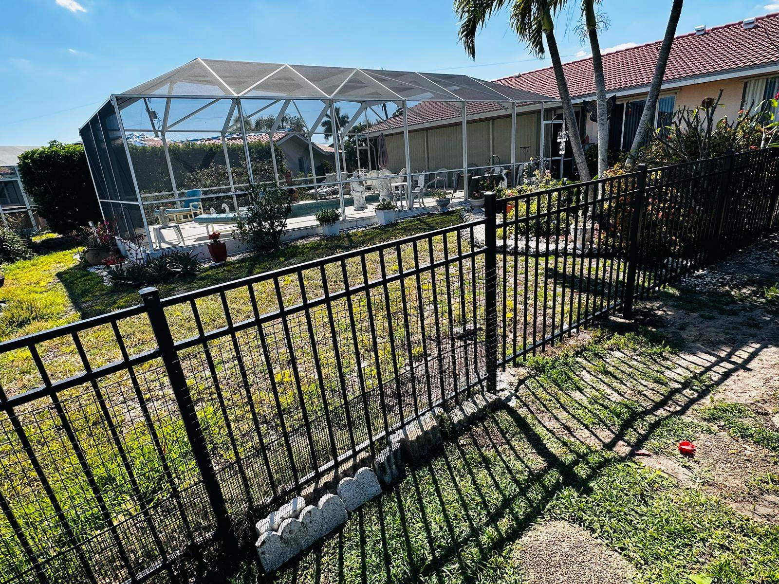 Waterfront Aluminum Picket Fence Installation in Punta Gorda by True Fence LLC