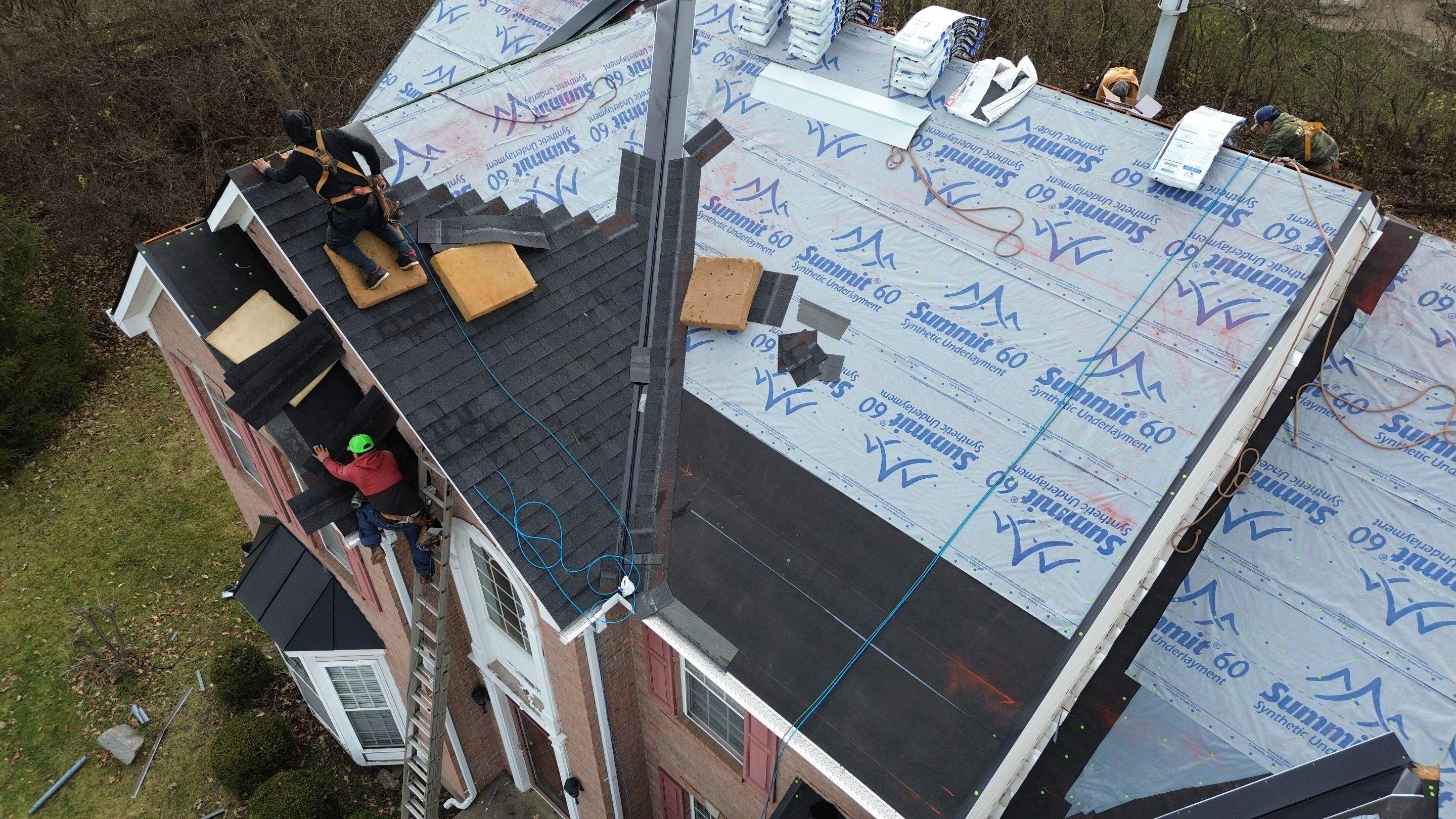 Walden Ponds - Pristine Black and Hydro Flo Gutter Guards by Tamlin Roofing