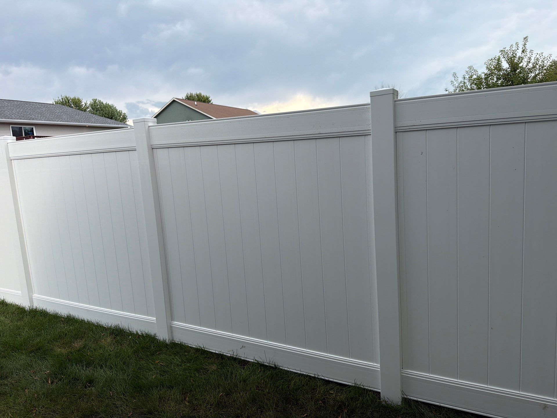 White Vinyl Privacy Fence Installation in Raymond, IA by Perfect Picket Fence and Stain