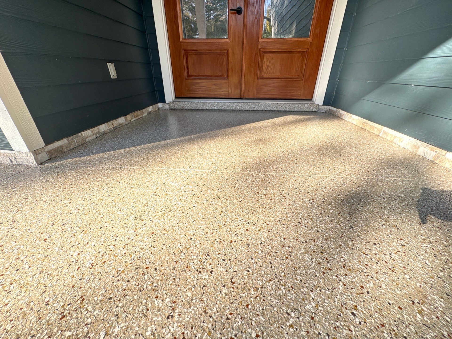 Front and Back Porches in Chiefland, FL in Pebble Beach by Cross Creek Concrete Coatings