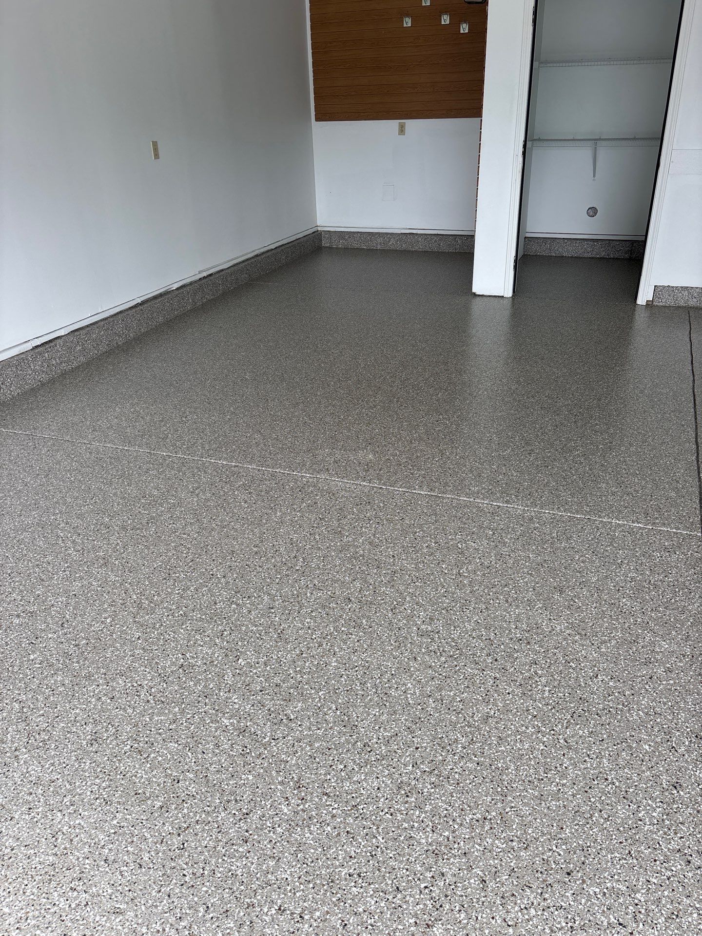 Garage floor in Holt using Smoke Flake by Freedom Concrete Coatings. 