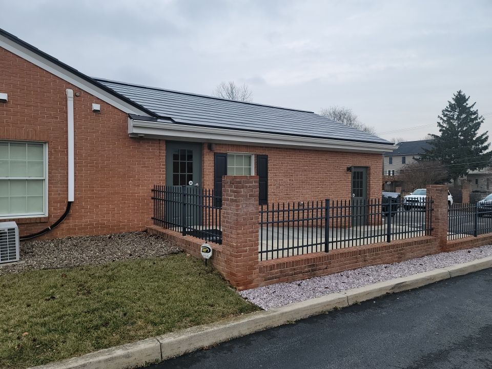 Tesla Solar Roof on a Commercial Building by American Home Contractors