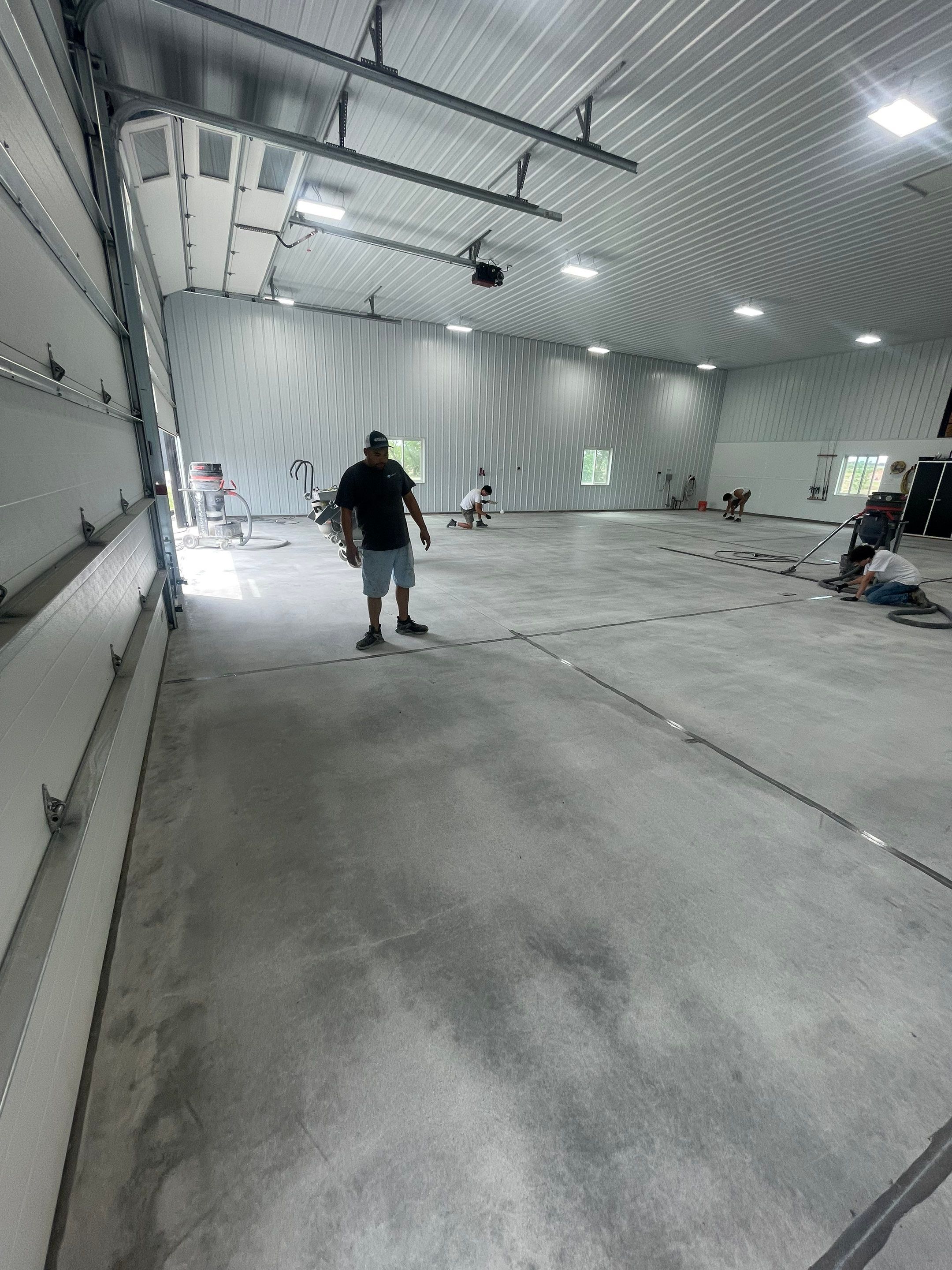 Multi-Stage Concrete Floor Coating for Egan Shop and RV Storage by Select Painting, Coatings & Garage Cabinets