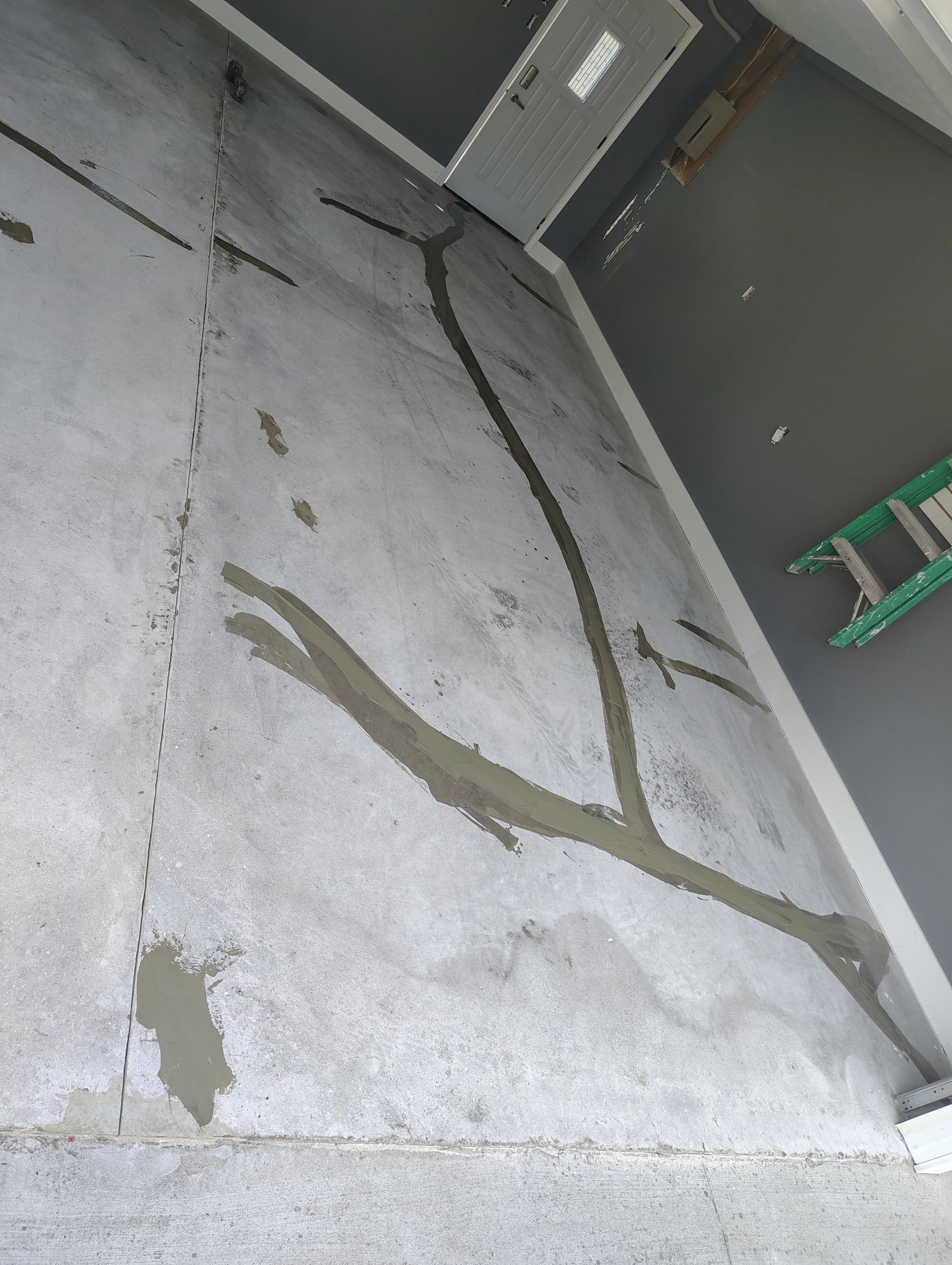 Custom Garage Floor Coating and Backyard Patio Refinishing in Tyndall by Select Painting, Coatings & Garage Cabinets