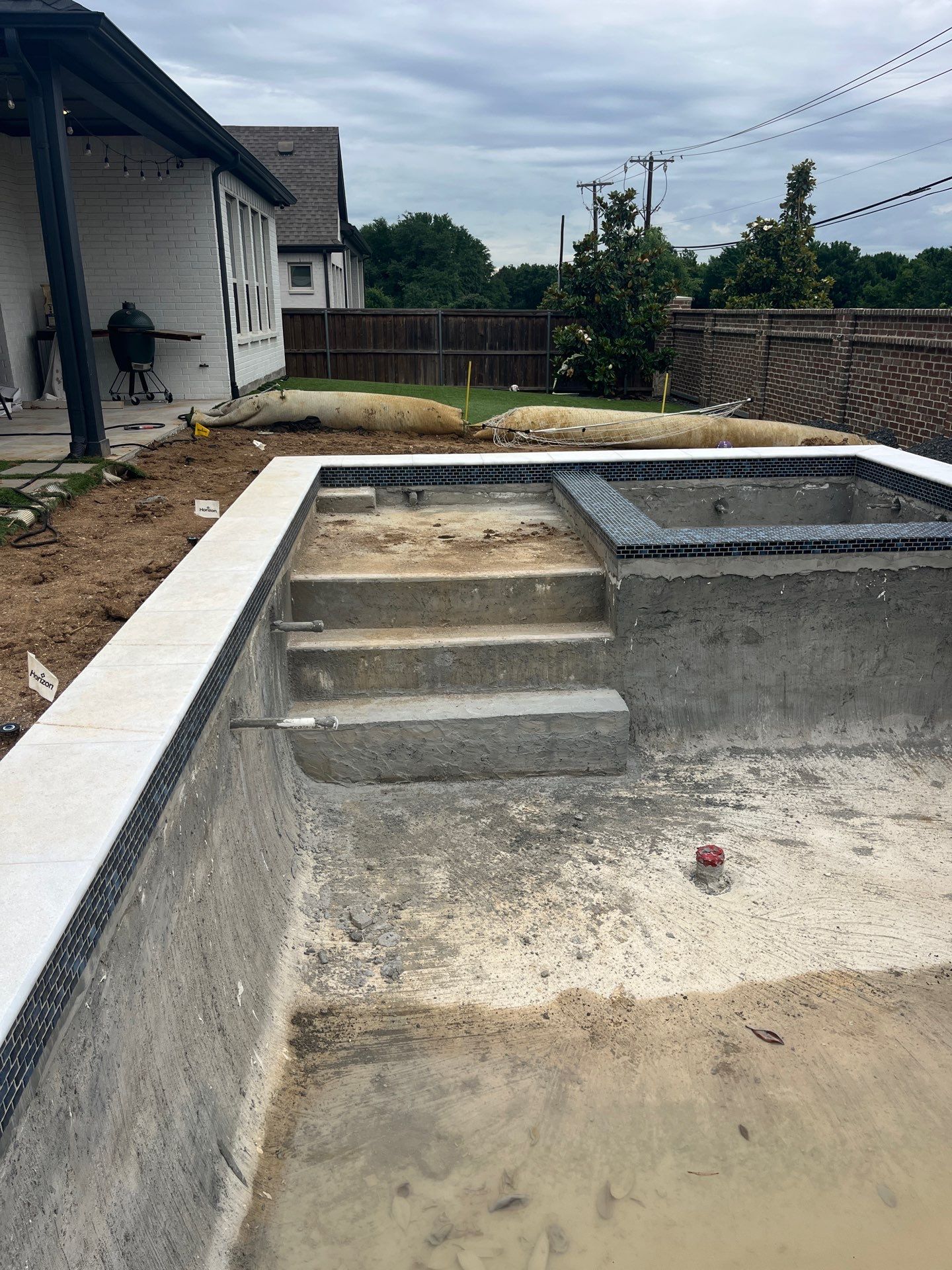 Modern Geometric Pool with Raised Spa and Turf Surround by Pinnacle Pools and Spas - DFW