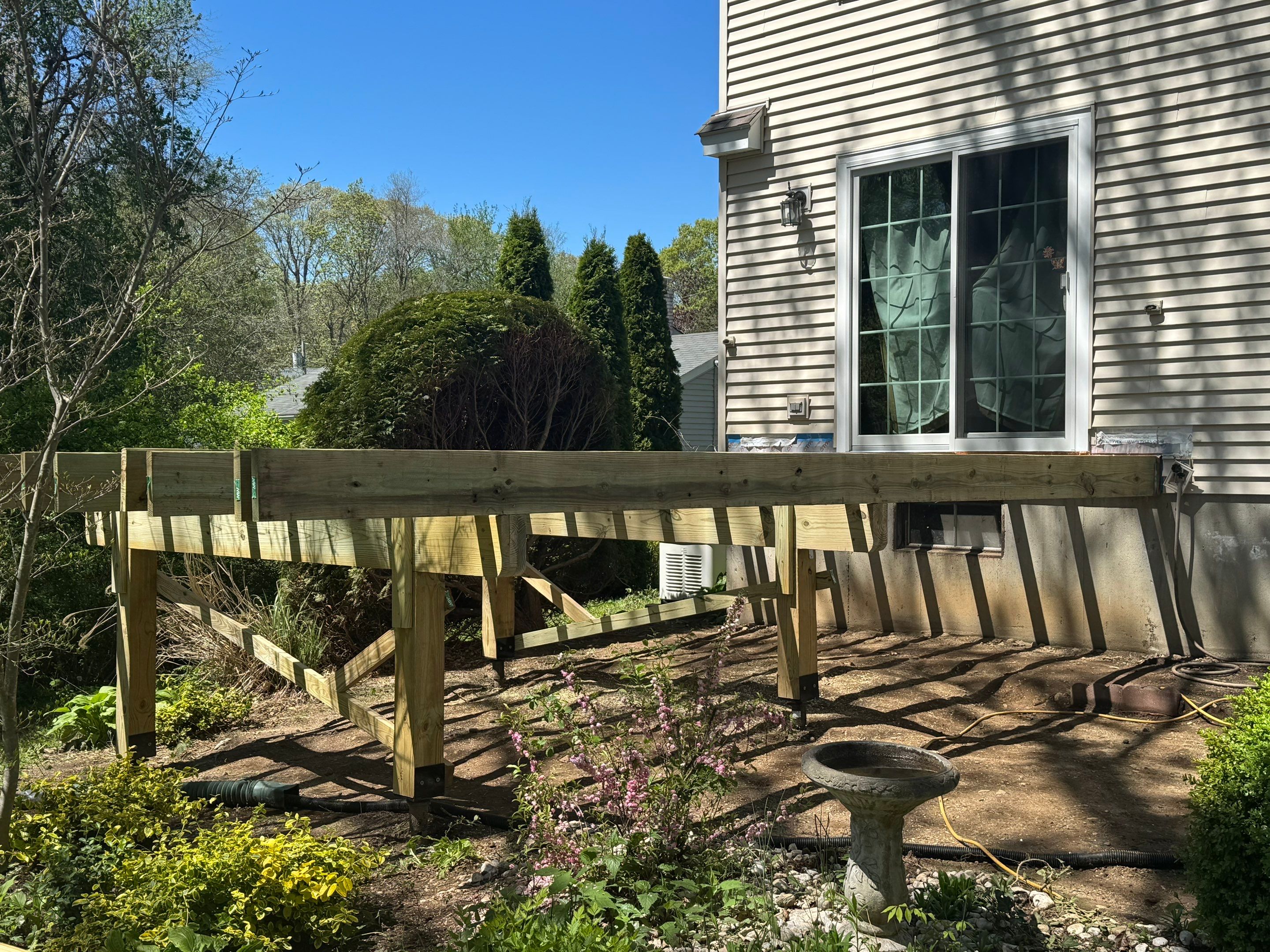 Deck replacement using Trex Transcend Rope Swing and Matching Rope Swing Transcend railing by DiGiorgi Roofing and Siding Inc
