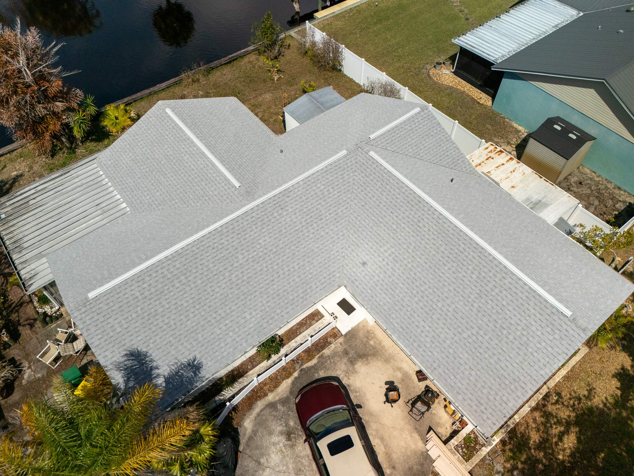 Merritt Island Roof Replacement Featuring Tamko Titan Glacier White Shingles by Wiedmann Construction & Roofing