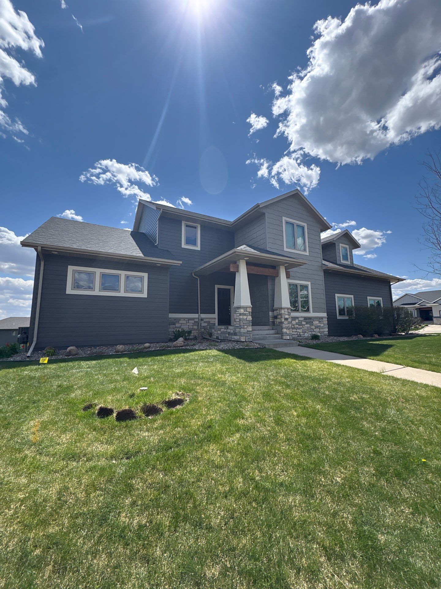 Residential Exterior Painting and Color Update in Sioux Falls by Select Painting, Coatings & Garage Cabinets