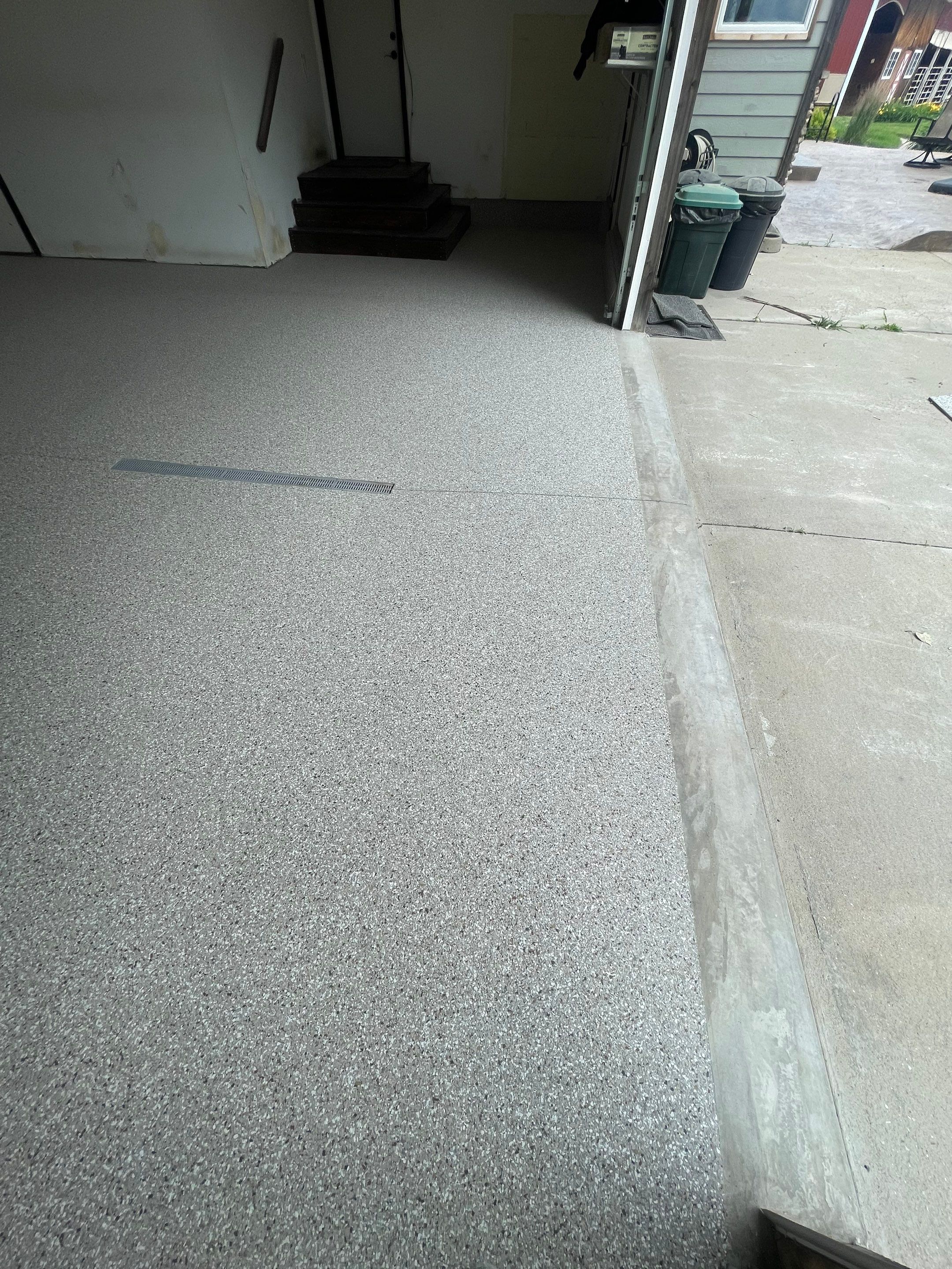Hartford Residential Garage Floor Transformation With Decorative Chip Coating by Select Painting, Coatings & Garage Cabinets