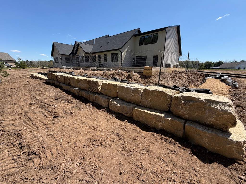 Limestone Boulder Wall by Sota landscaping