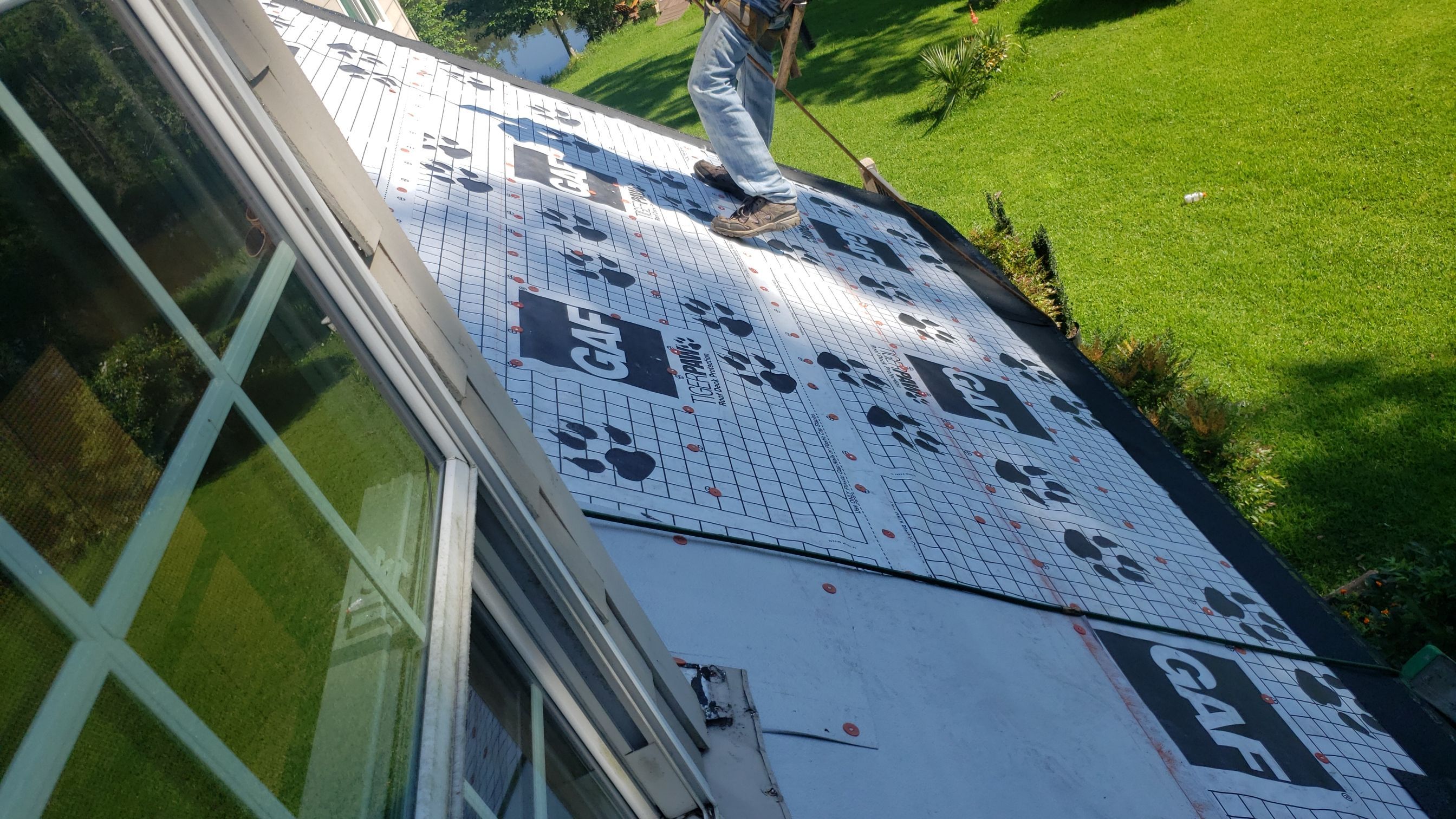 Residential Roofing Installation using Roof Replacement by American Roofing & Construction LLC