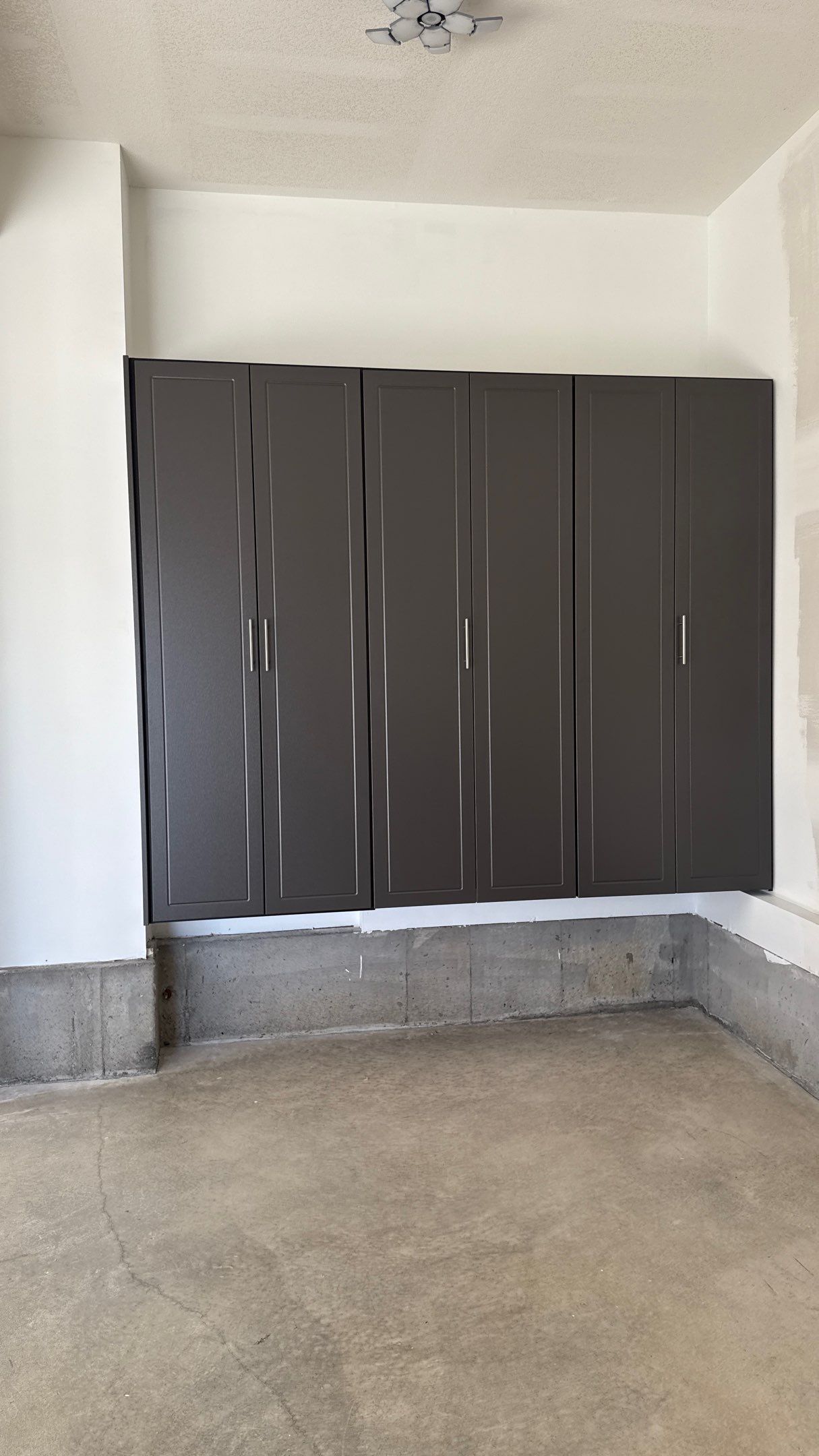 Nice Clean Look With These Pewter Cabinets by Banner Garage